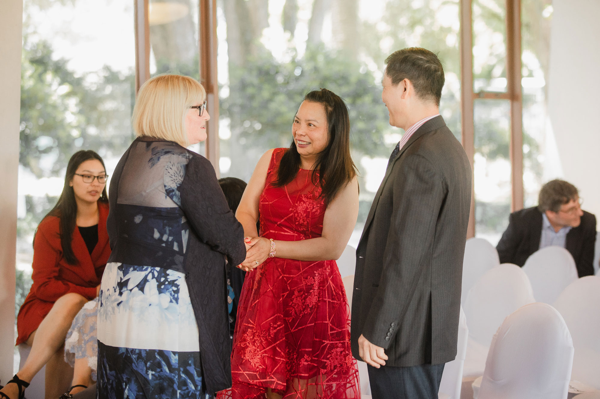 wedding celebrant talking to parents of the groom