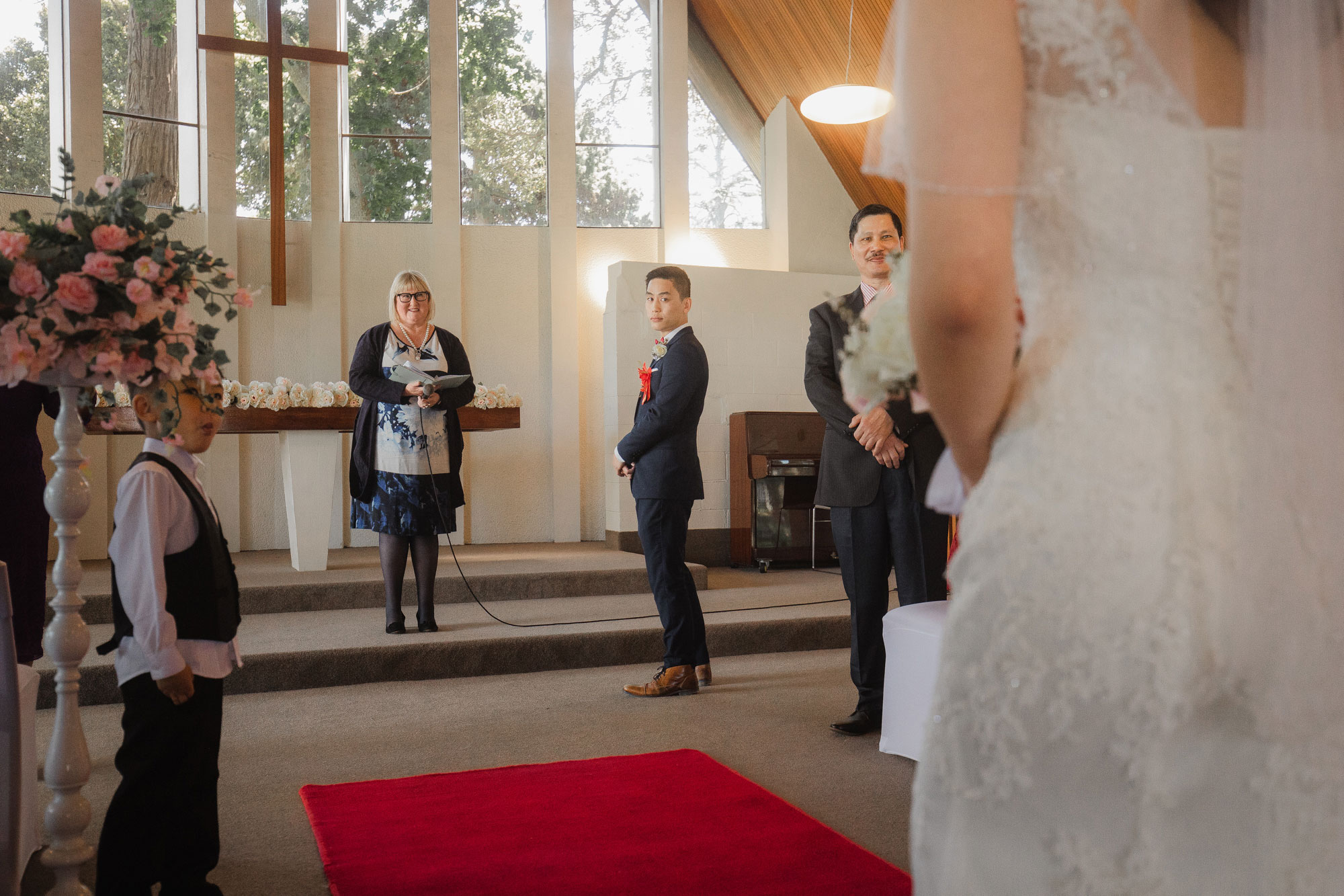 groom looking at the bride