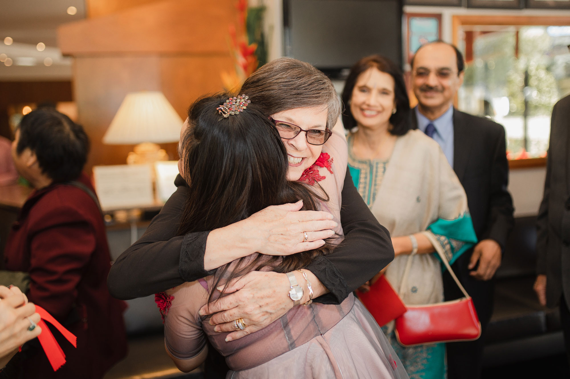 wedding guests hugging