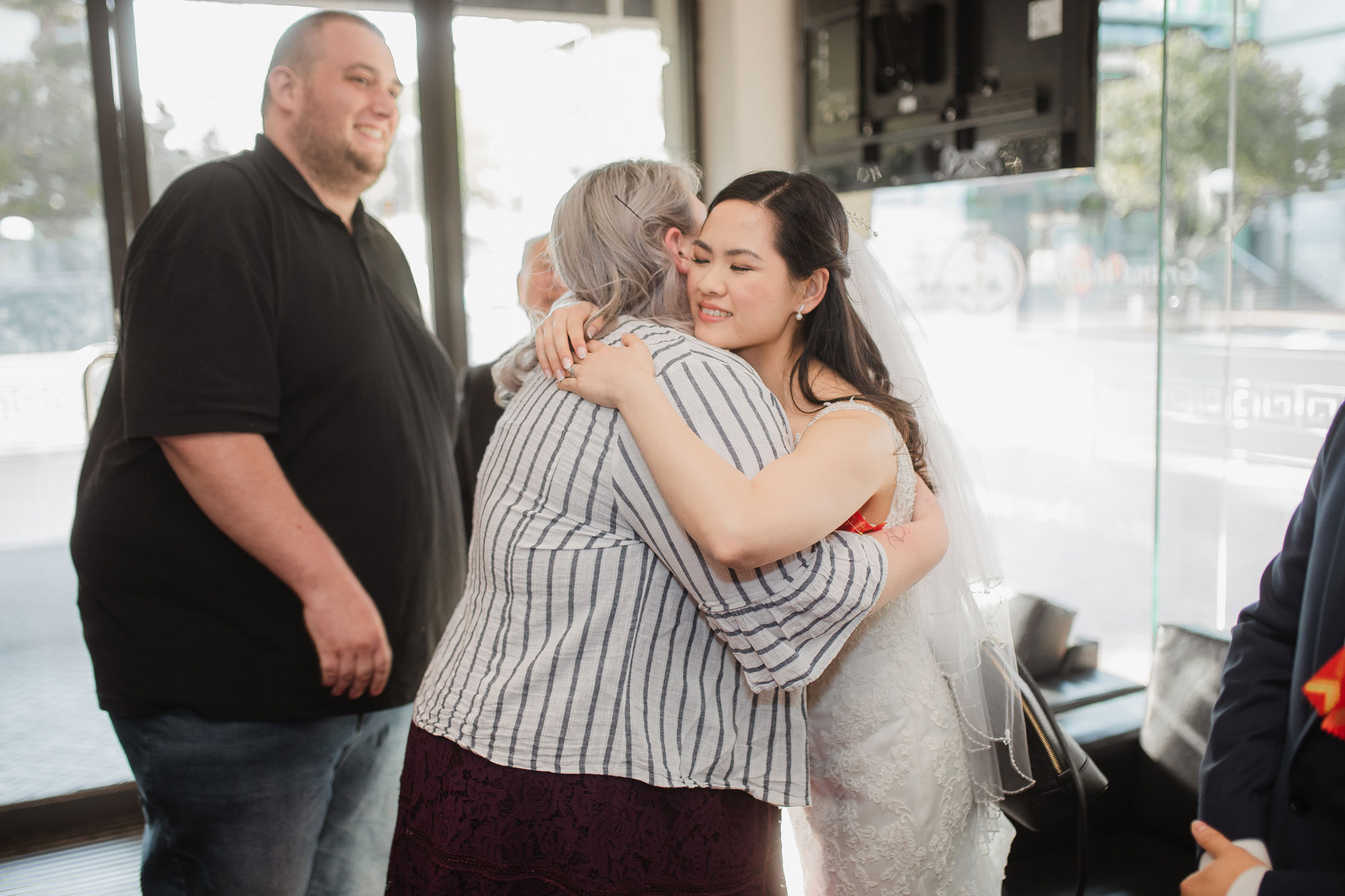 bride hugging guests