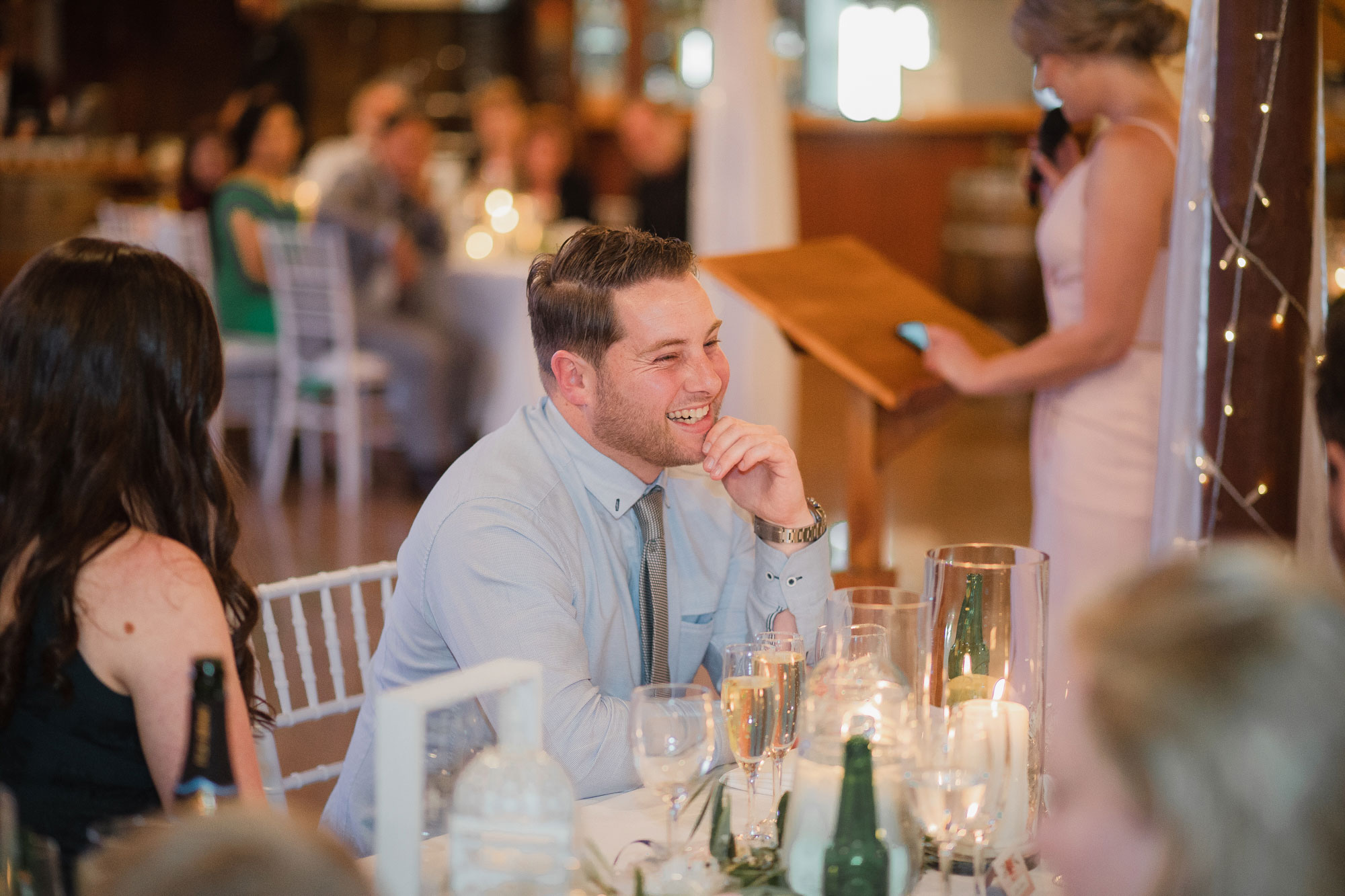 brother of the groom laughing