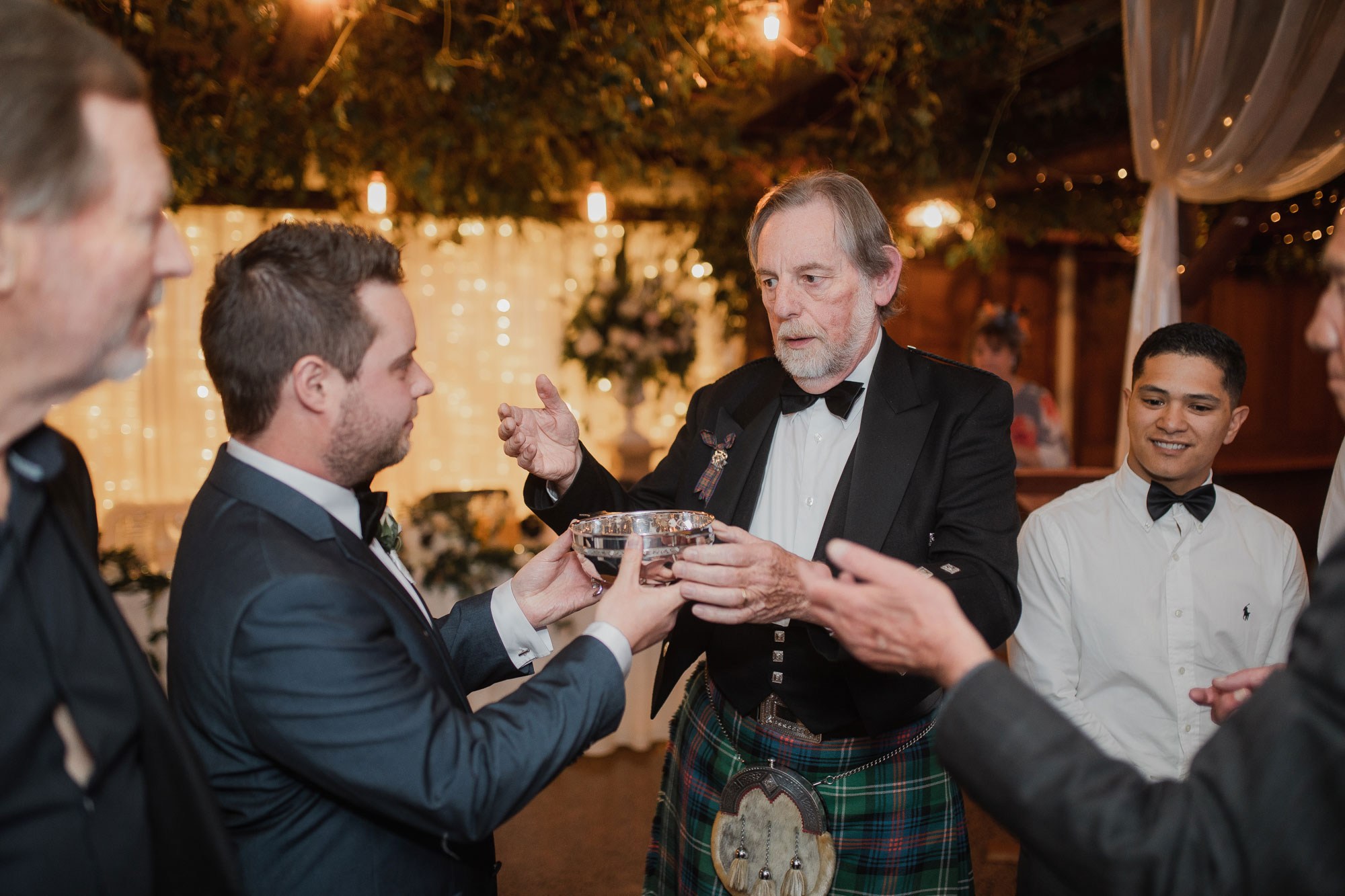 groom participating in traditional wedding formality