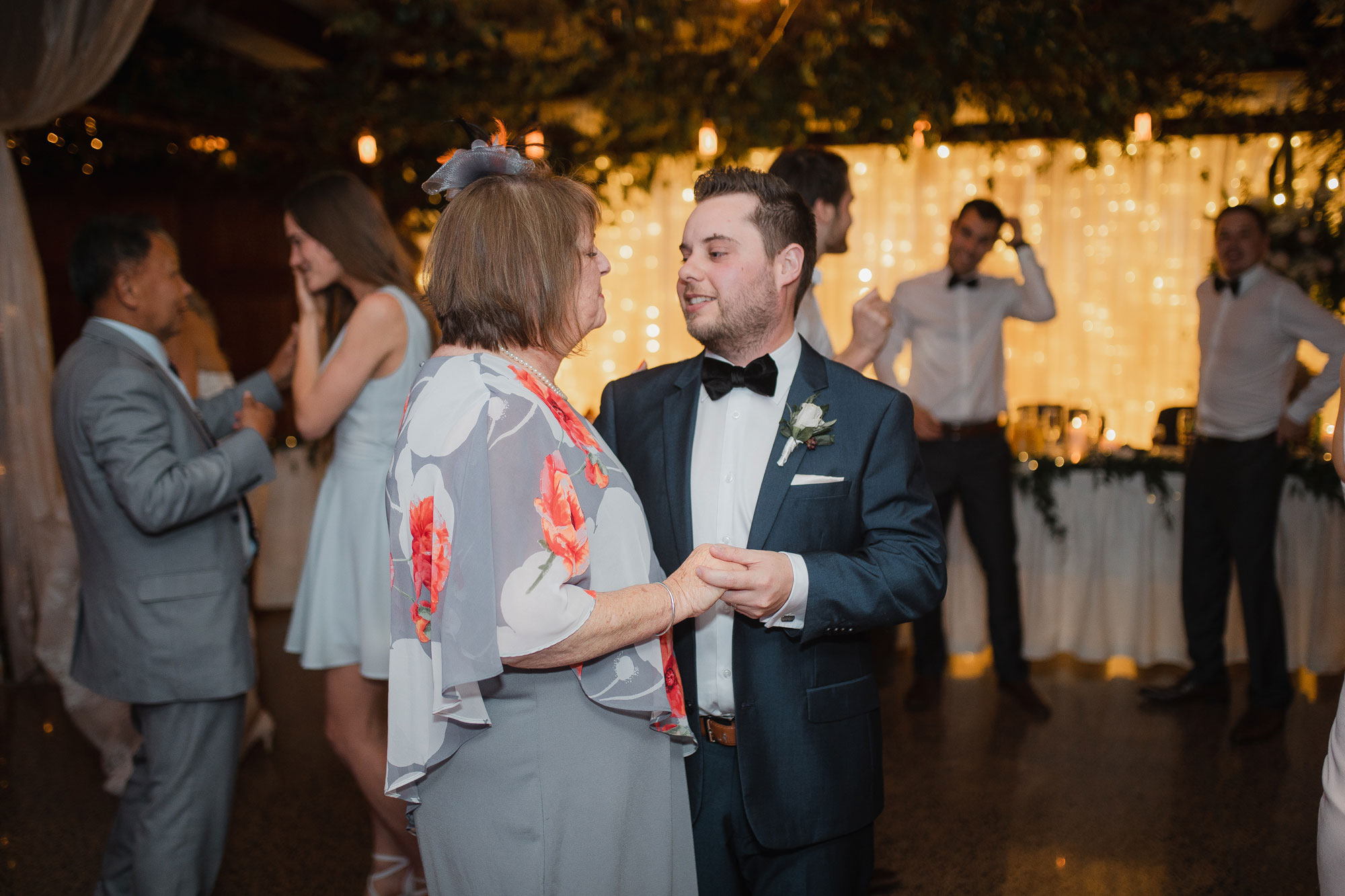 groom and mother dance at the wedding