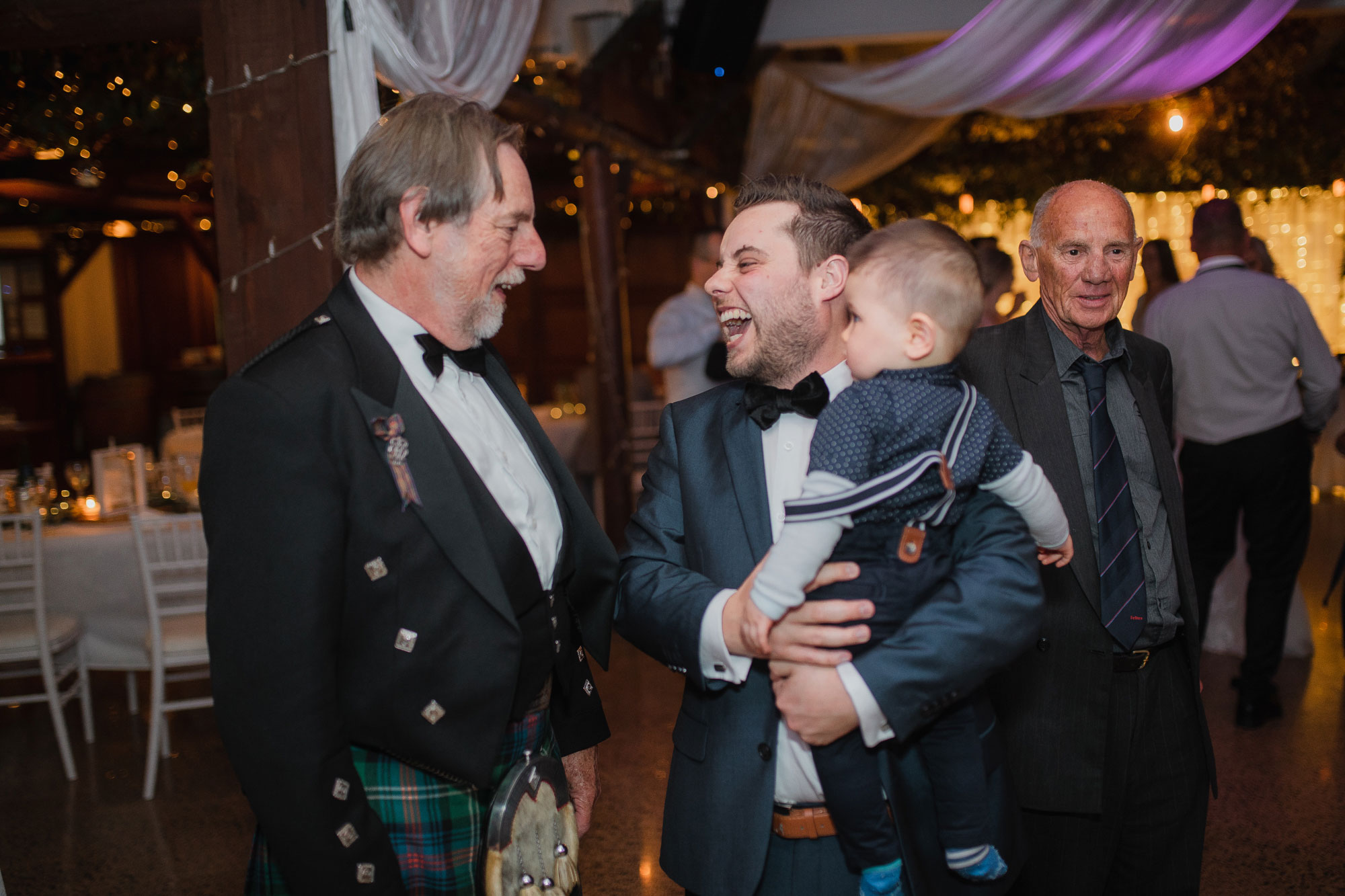 groom chatting with guests