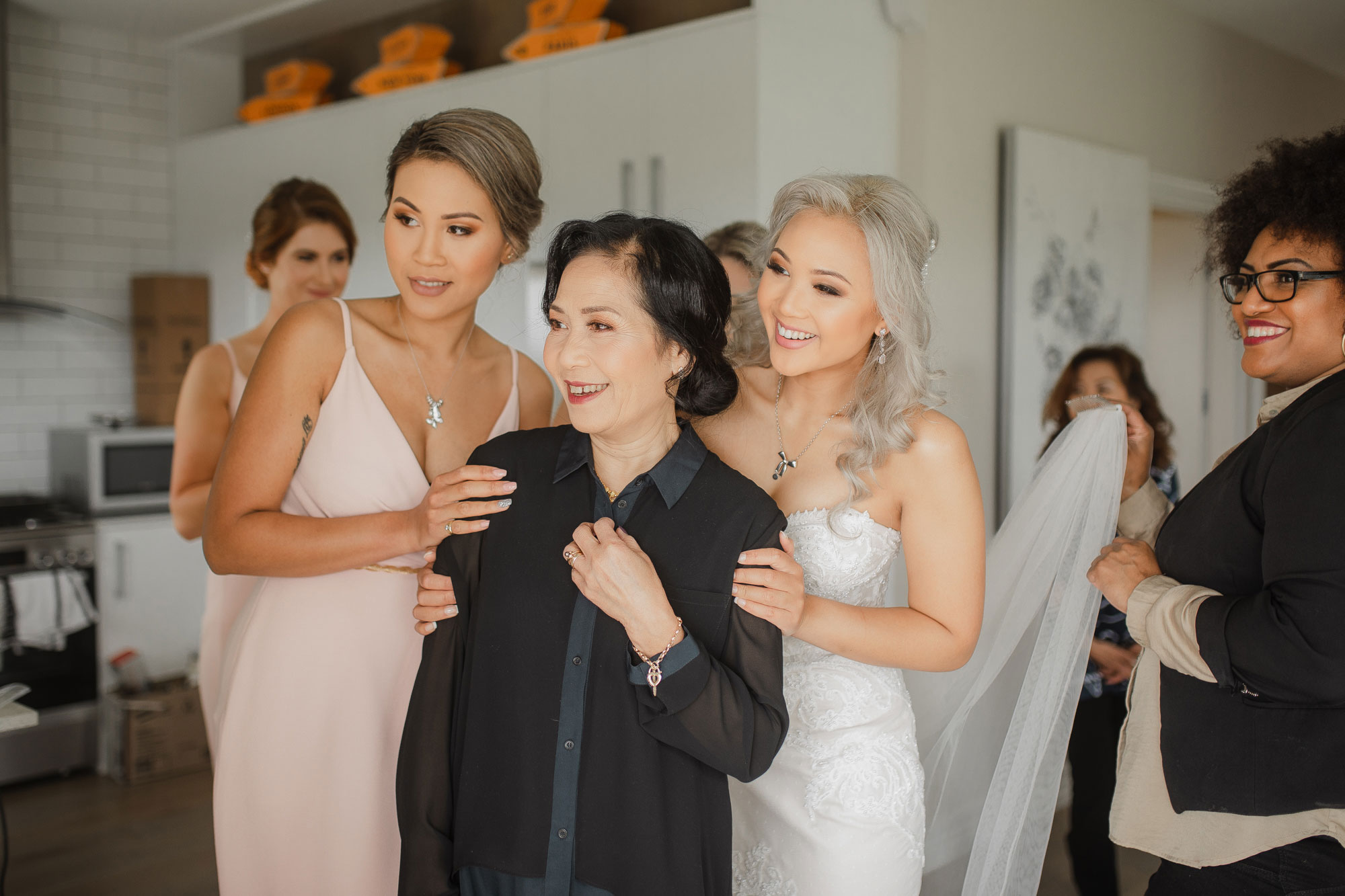 bride and mother smiling