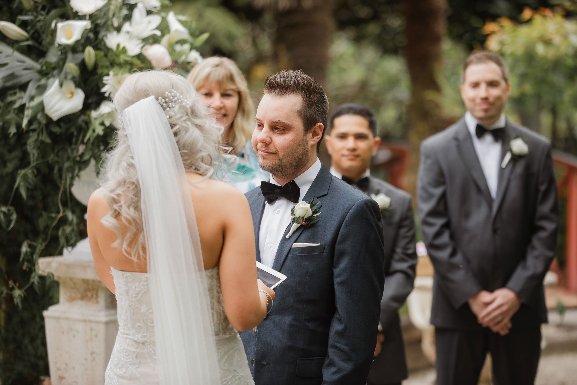 groom looking at the bride