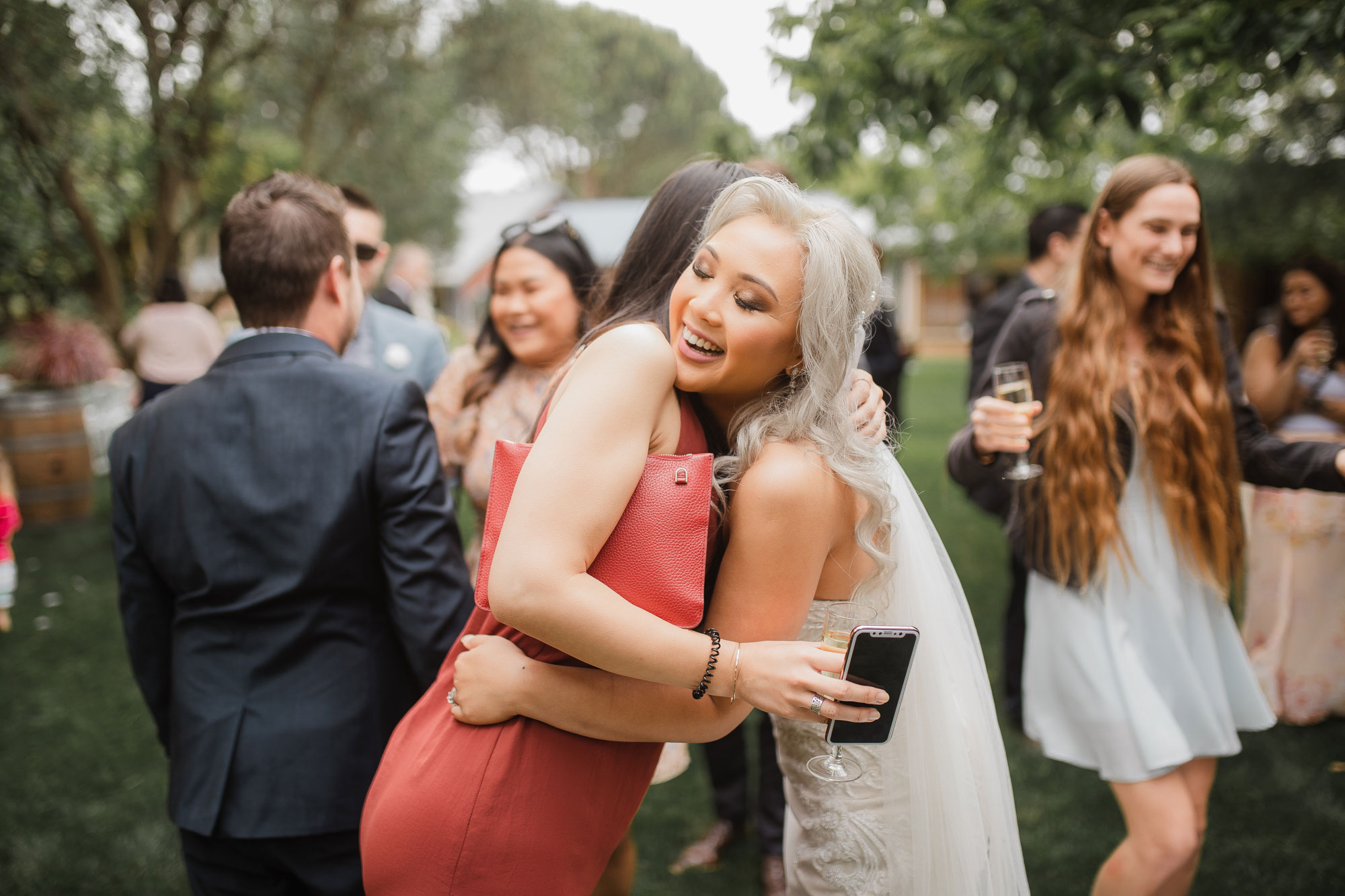 wedding guest hugging the bride