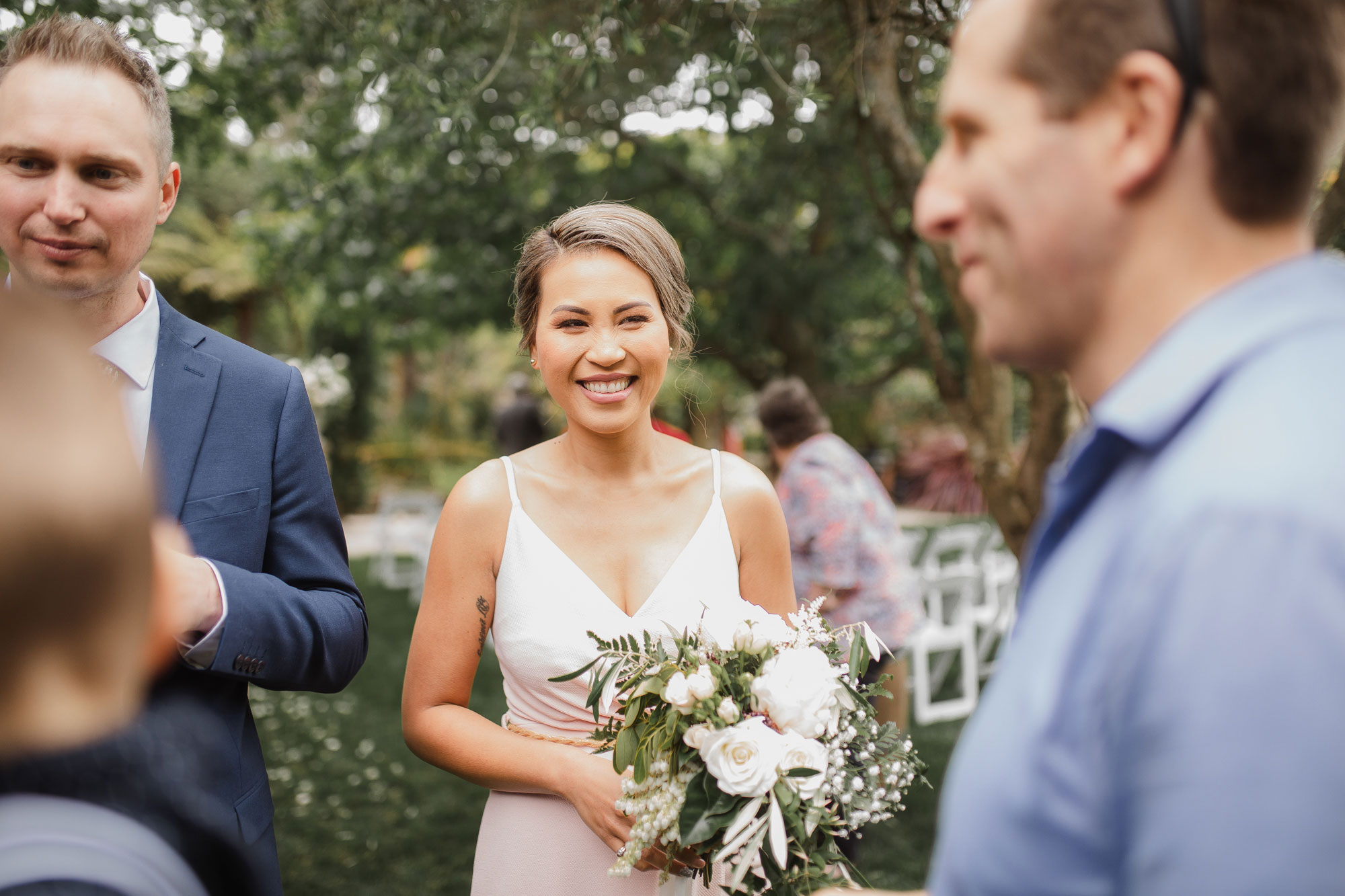 bridesmaid smiling at auckland wedding