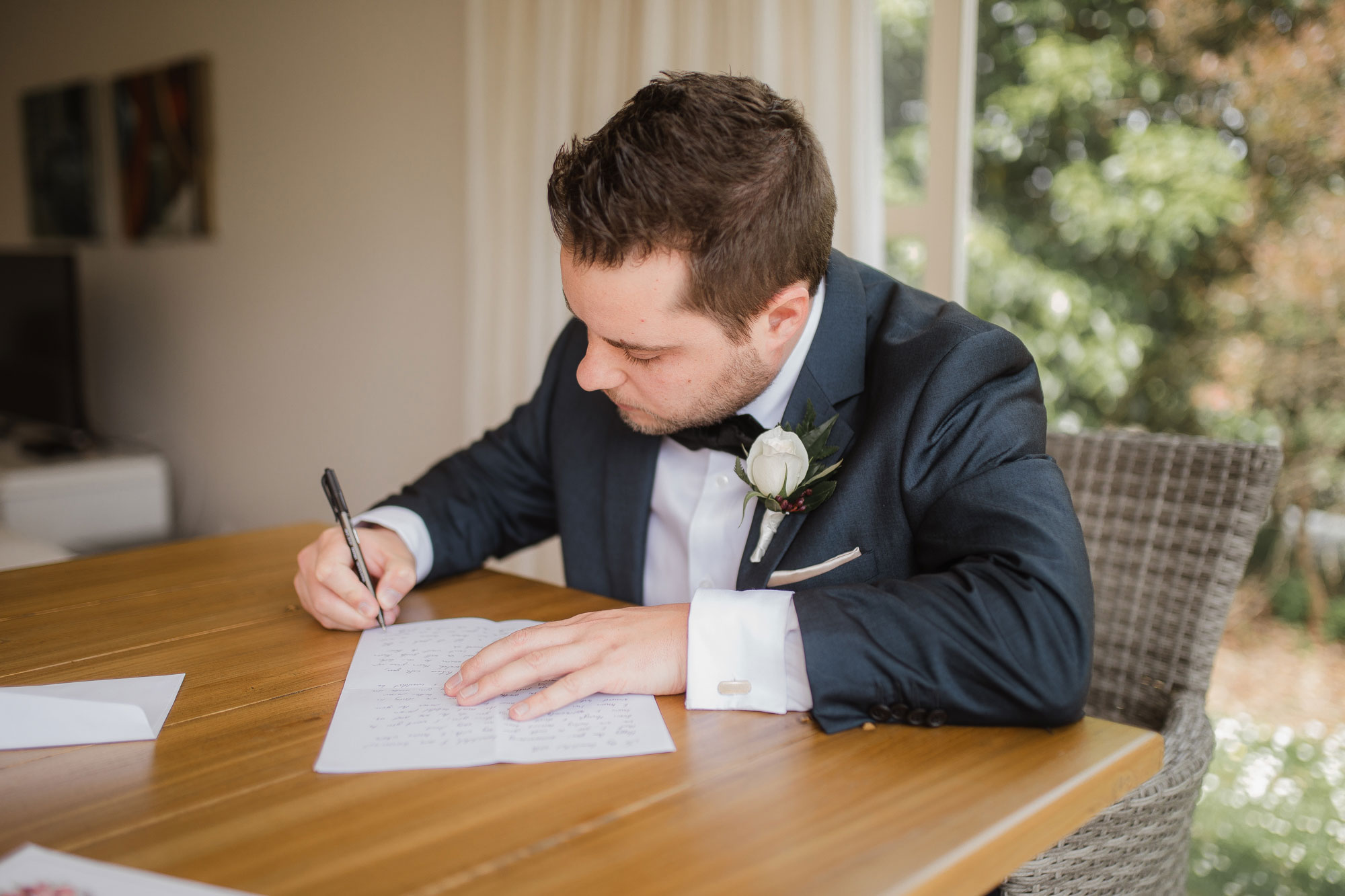groom writing letter