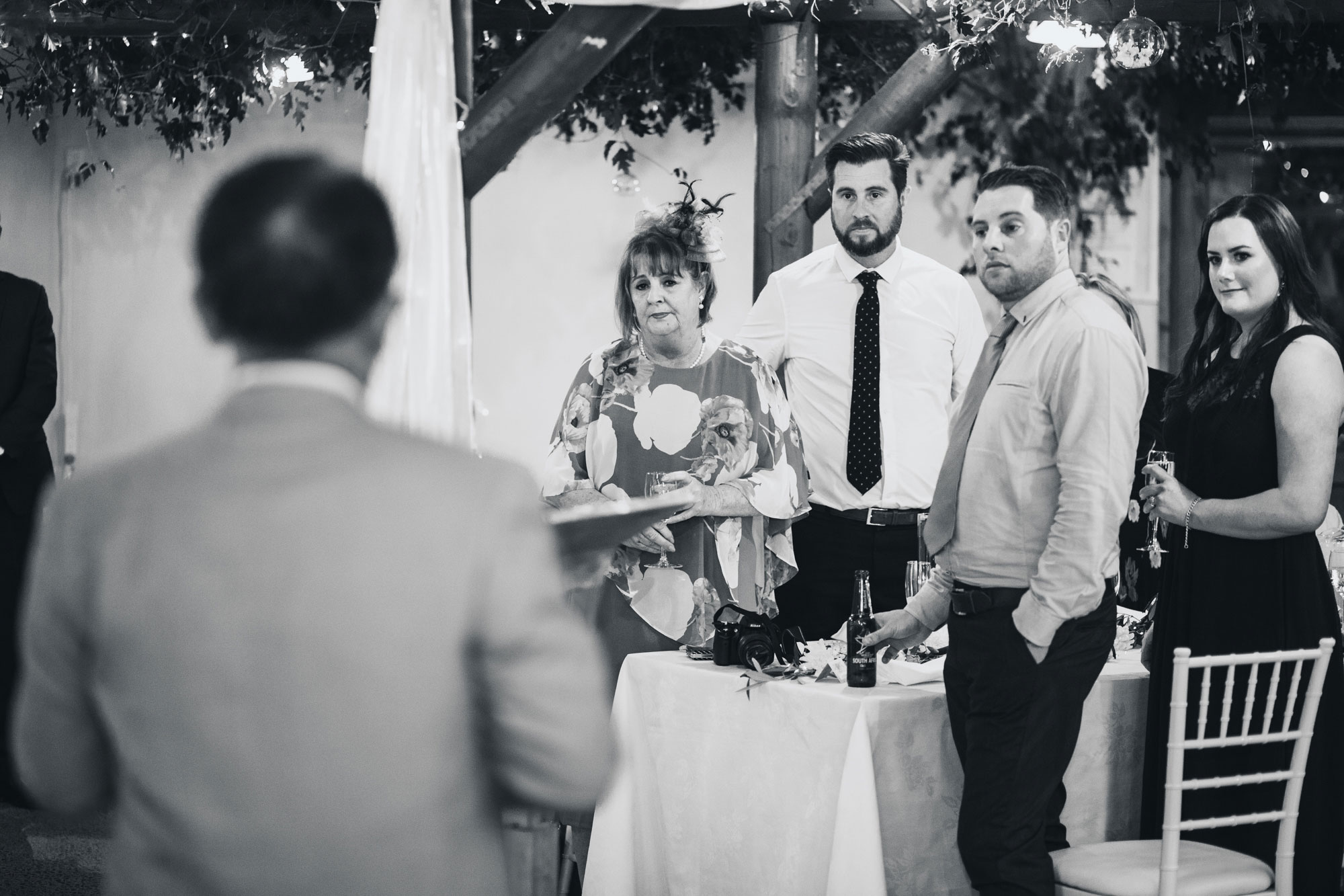 family of the groom listening to speech