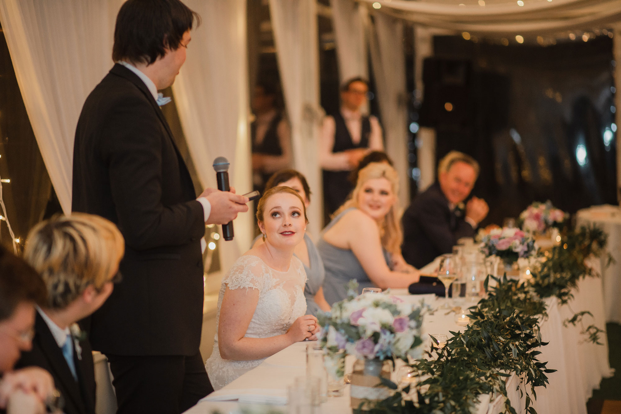 bride listening to groom speech