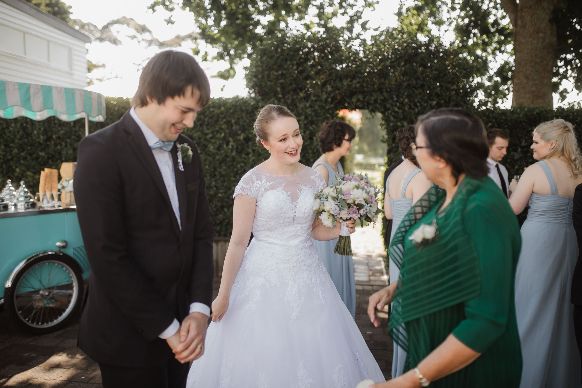 bride and groom chatting with guests