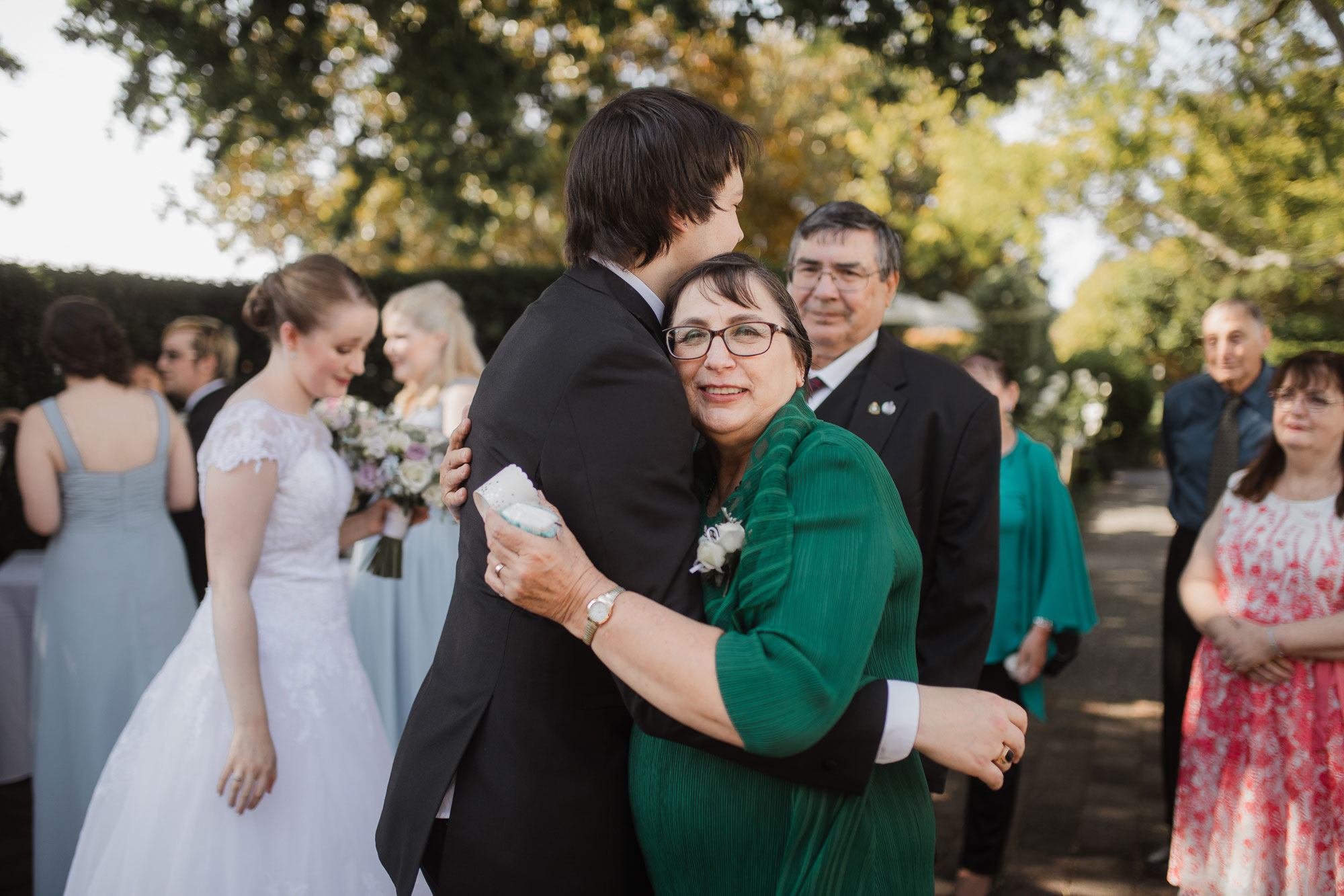 mother of the groom hugging