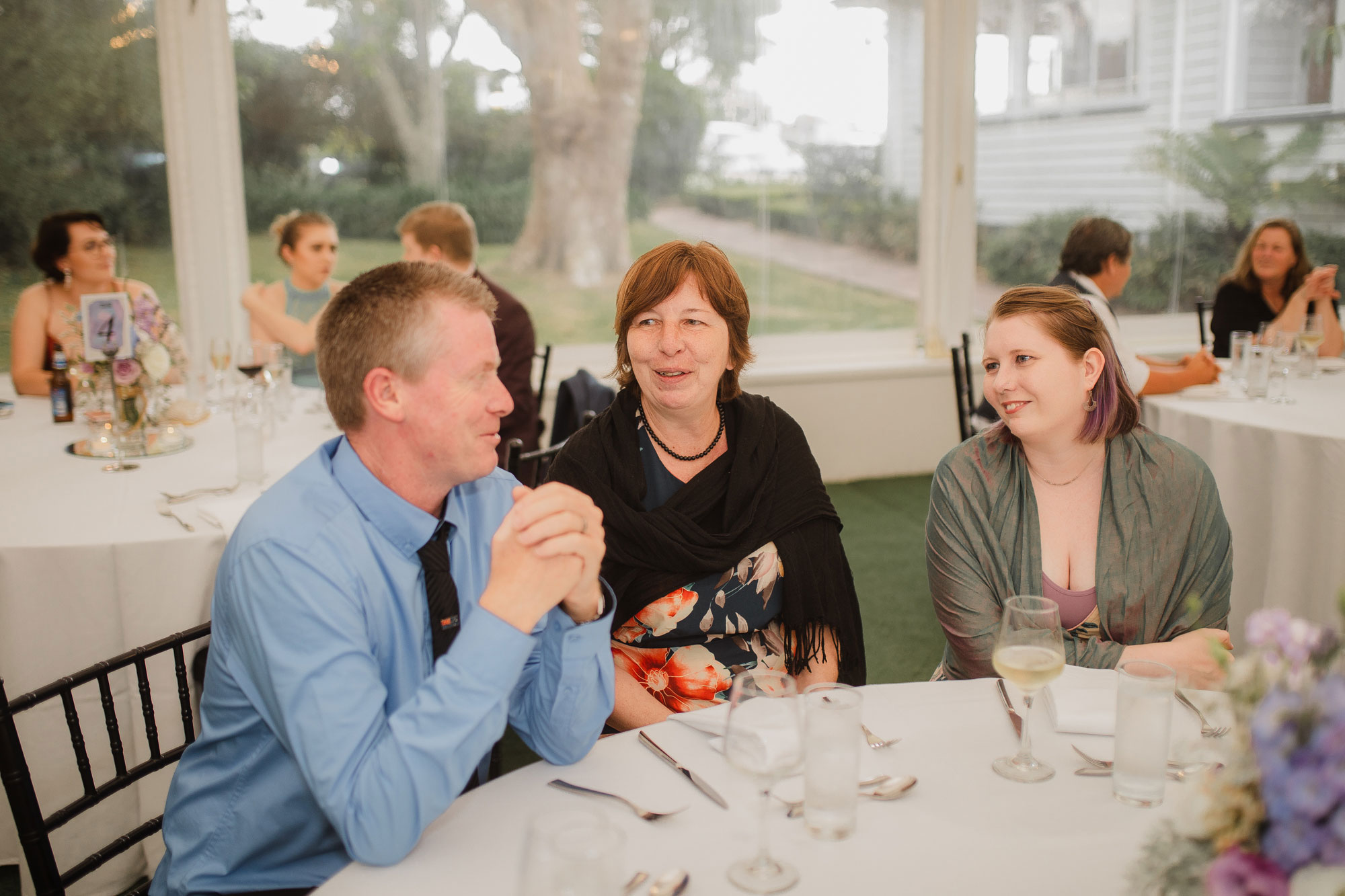 wedding guests chatting at reception