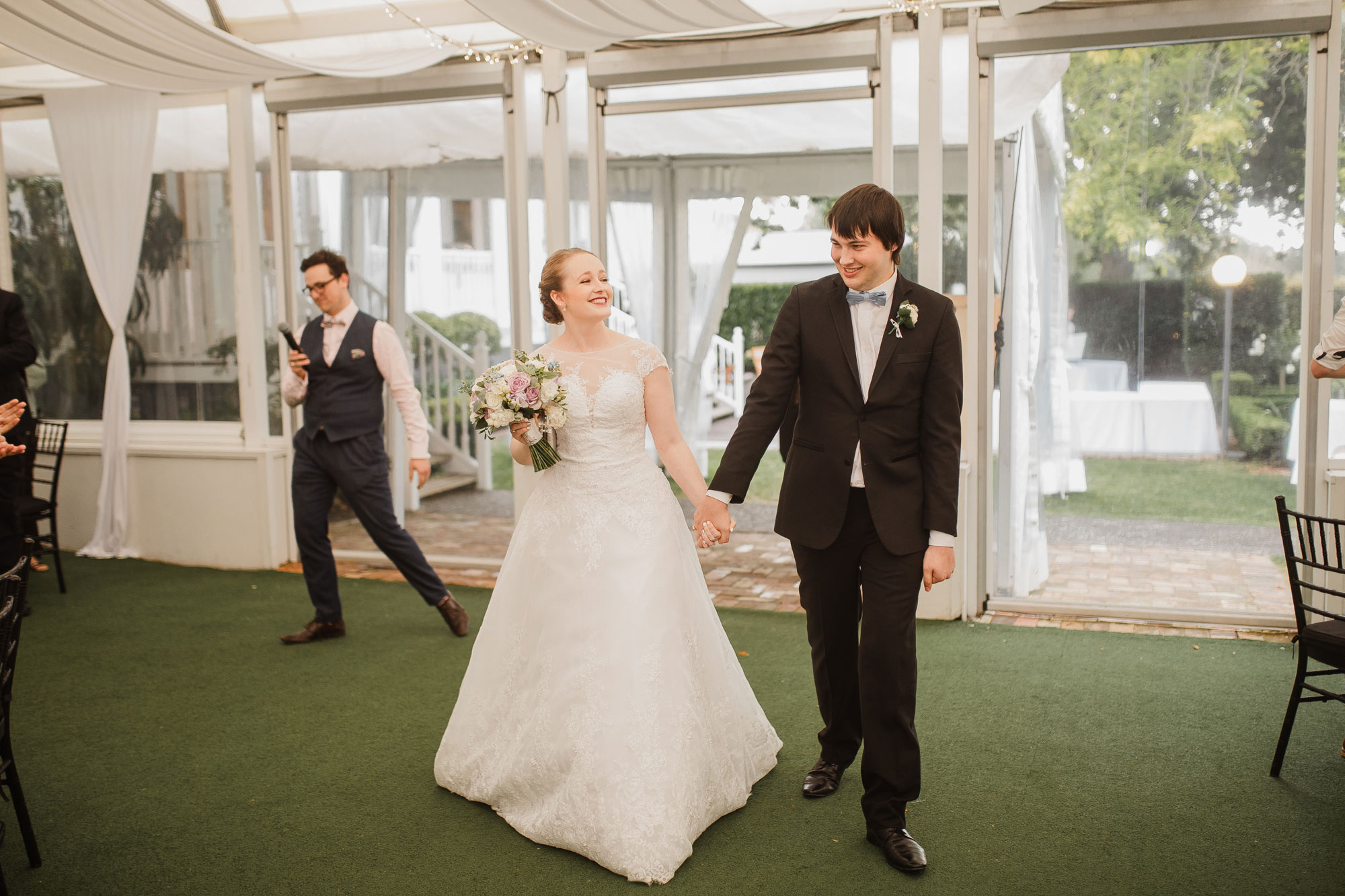 bride and groom arrive at allely estate reception