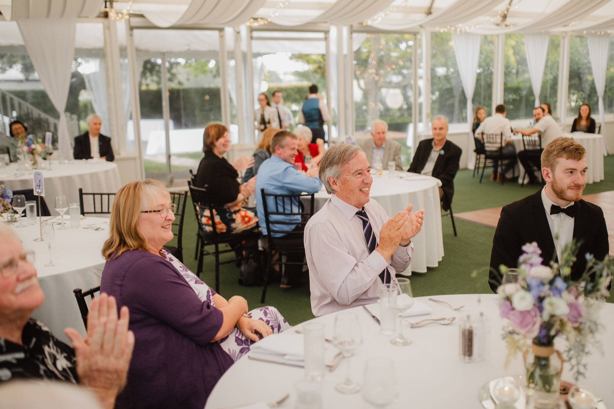 wedding guests welcoming bride and groom