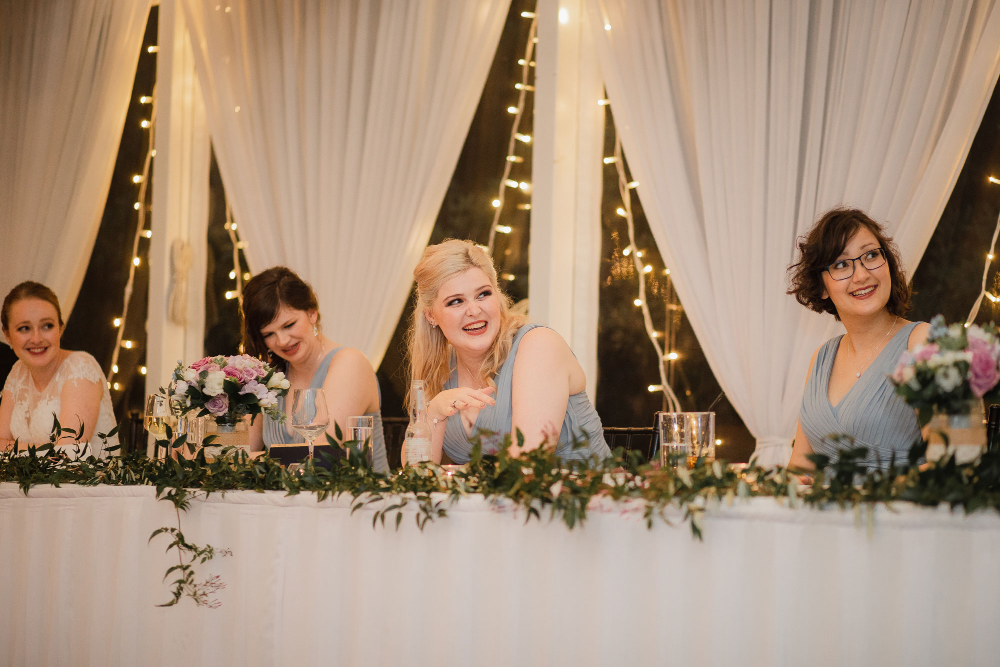 bridesmaids listening to speeches