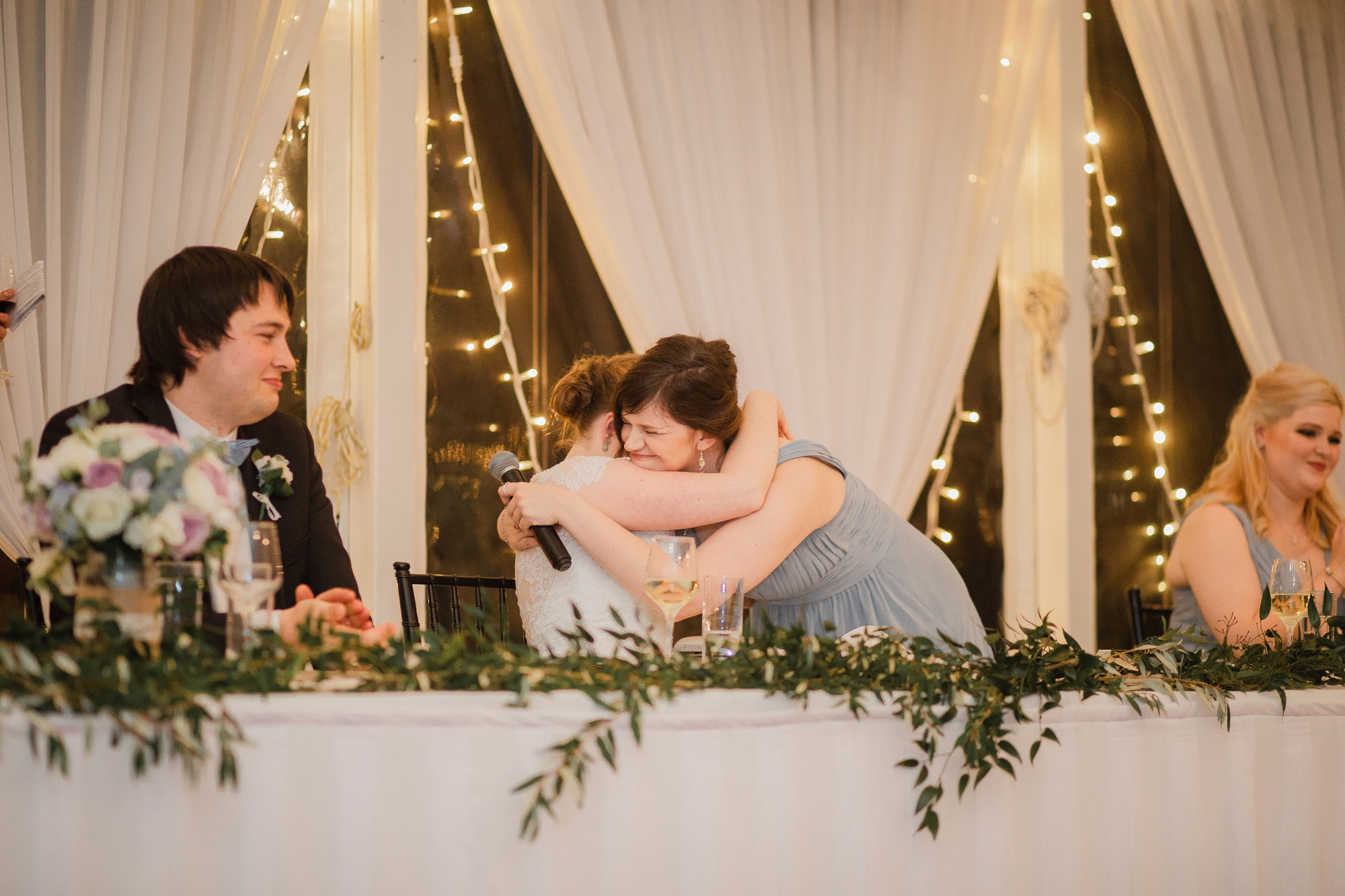 maid of honour hugging bride