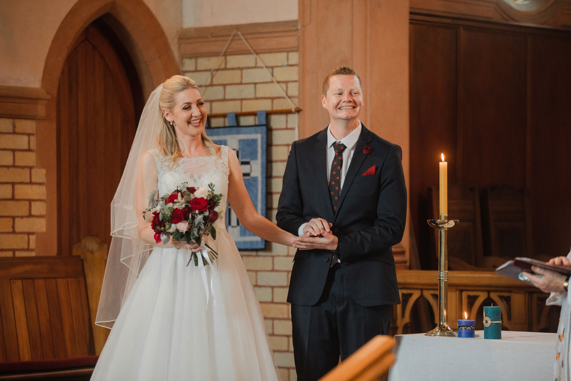 bride and groom smiling