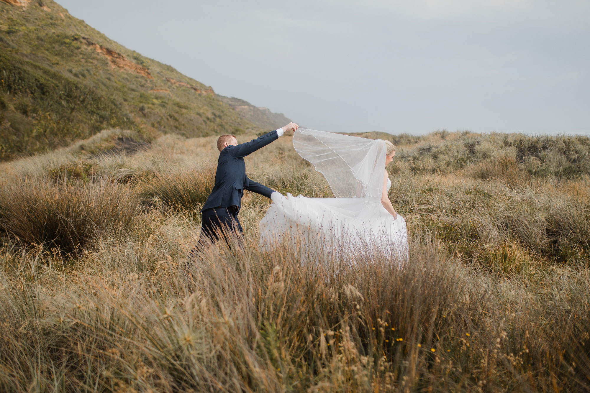 bride and groom on dunes