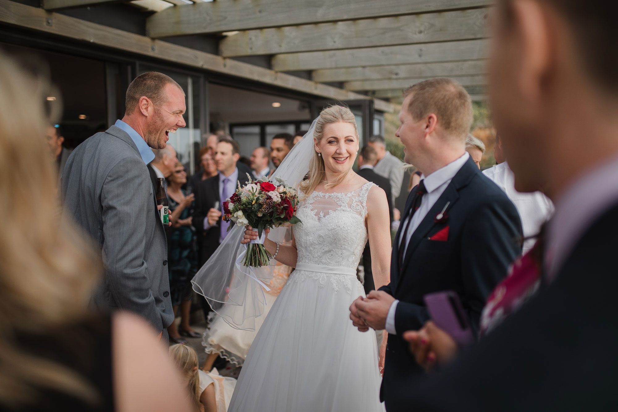 bride and groom greeting guests