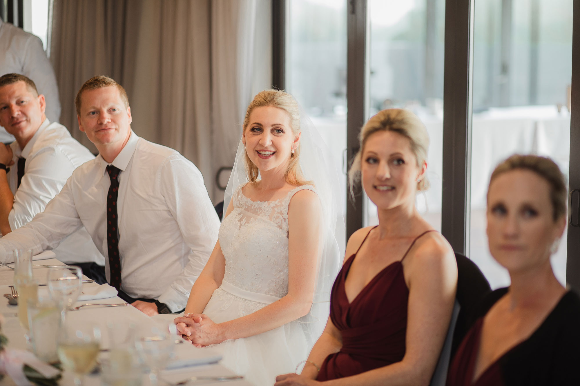 bridal party listening to speech