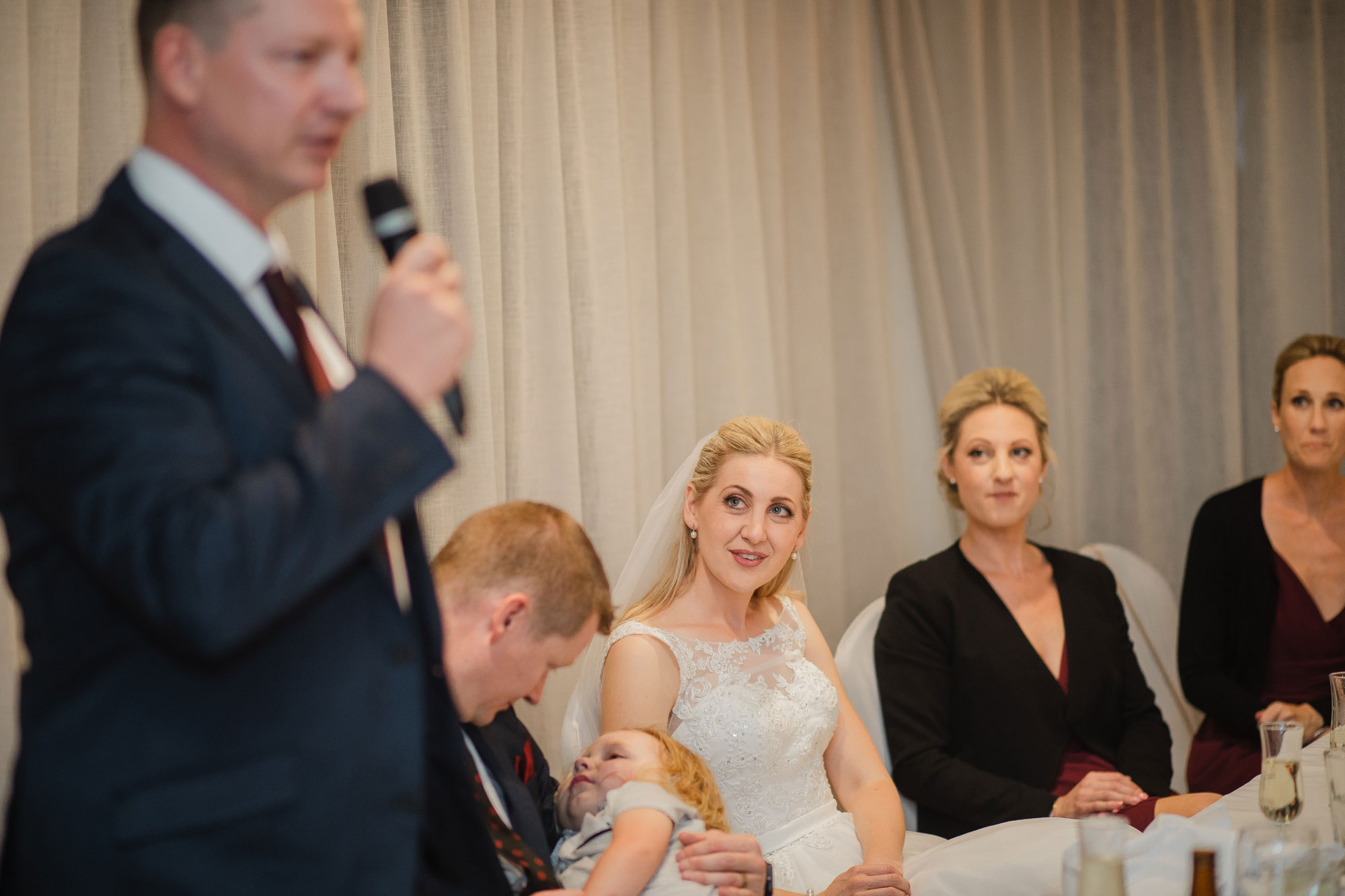 bride listening to wedding speech