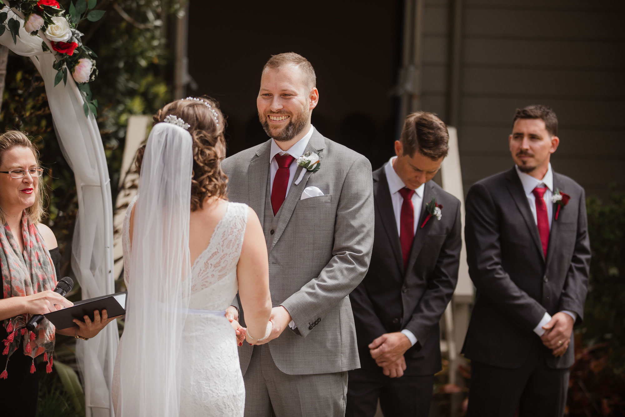 groom smiling at the bride