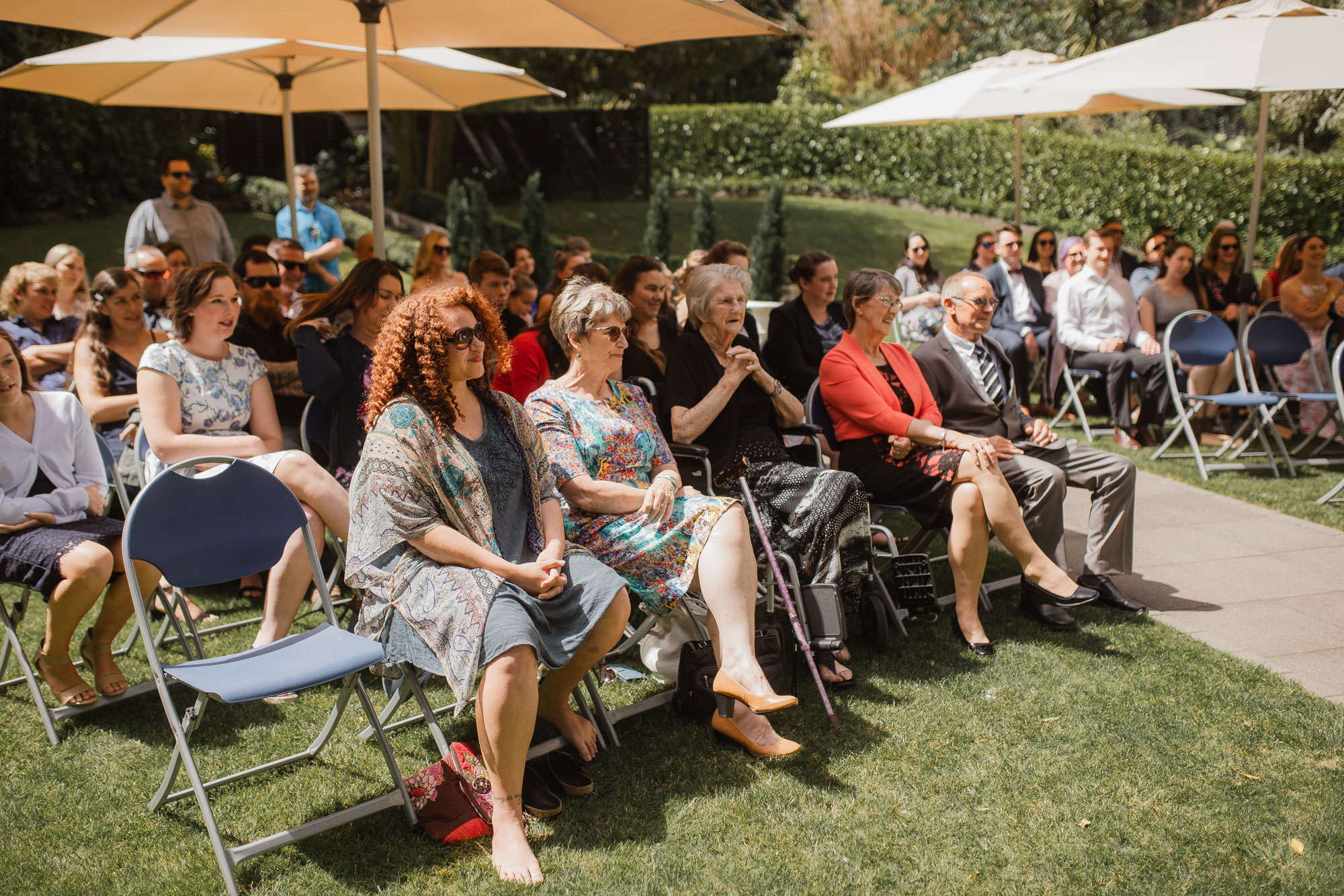 wedding guests listening to wedding vows