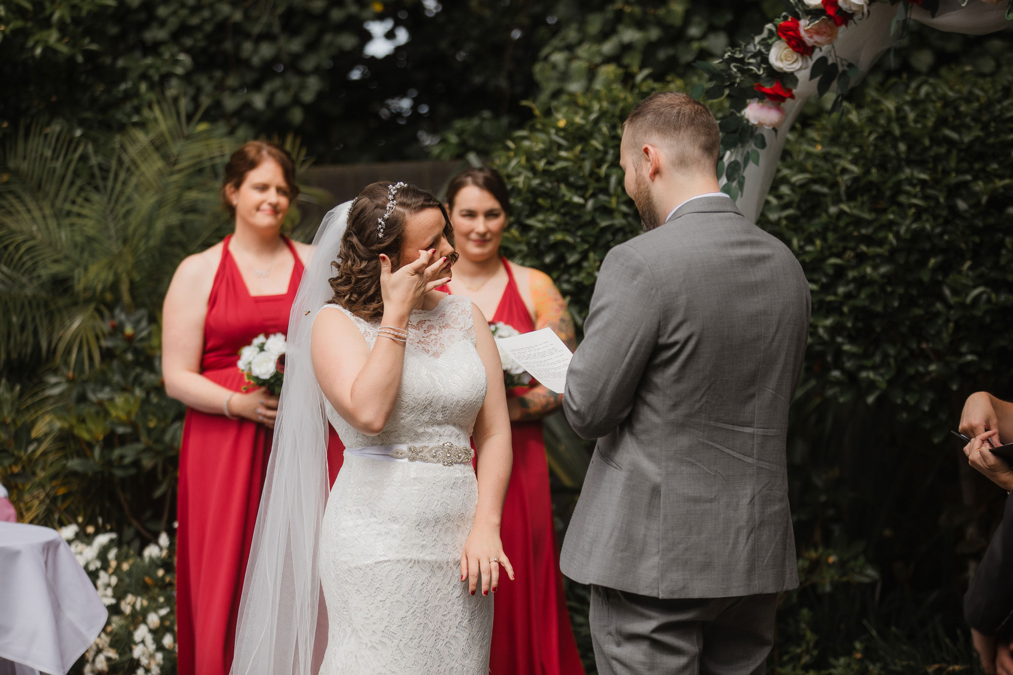 bride tearing up at the wedding ceremony