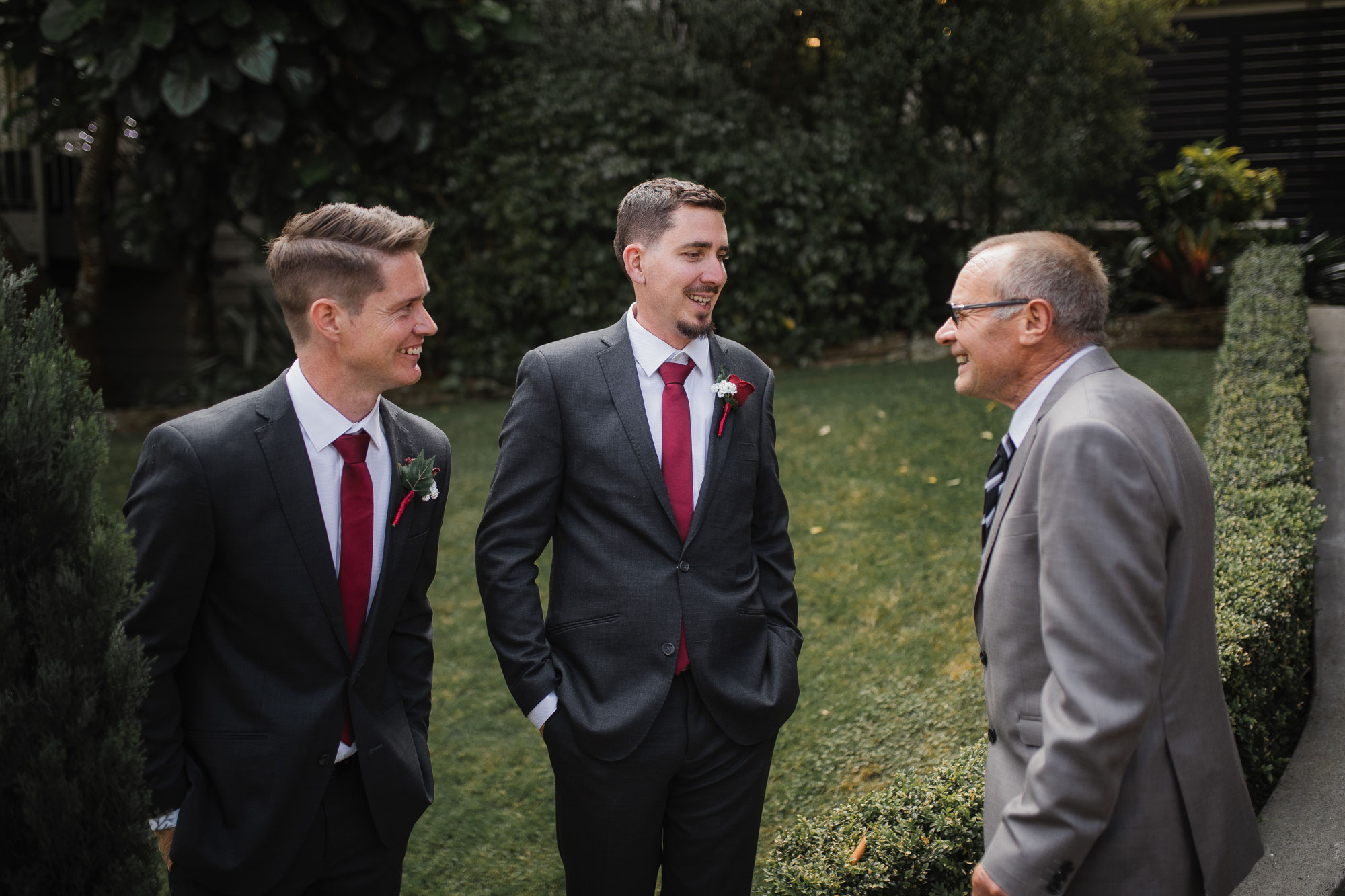 groomsmen mingling with wedding guests