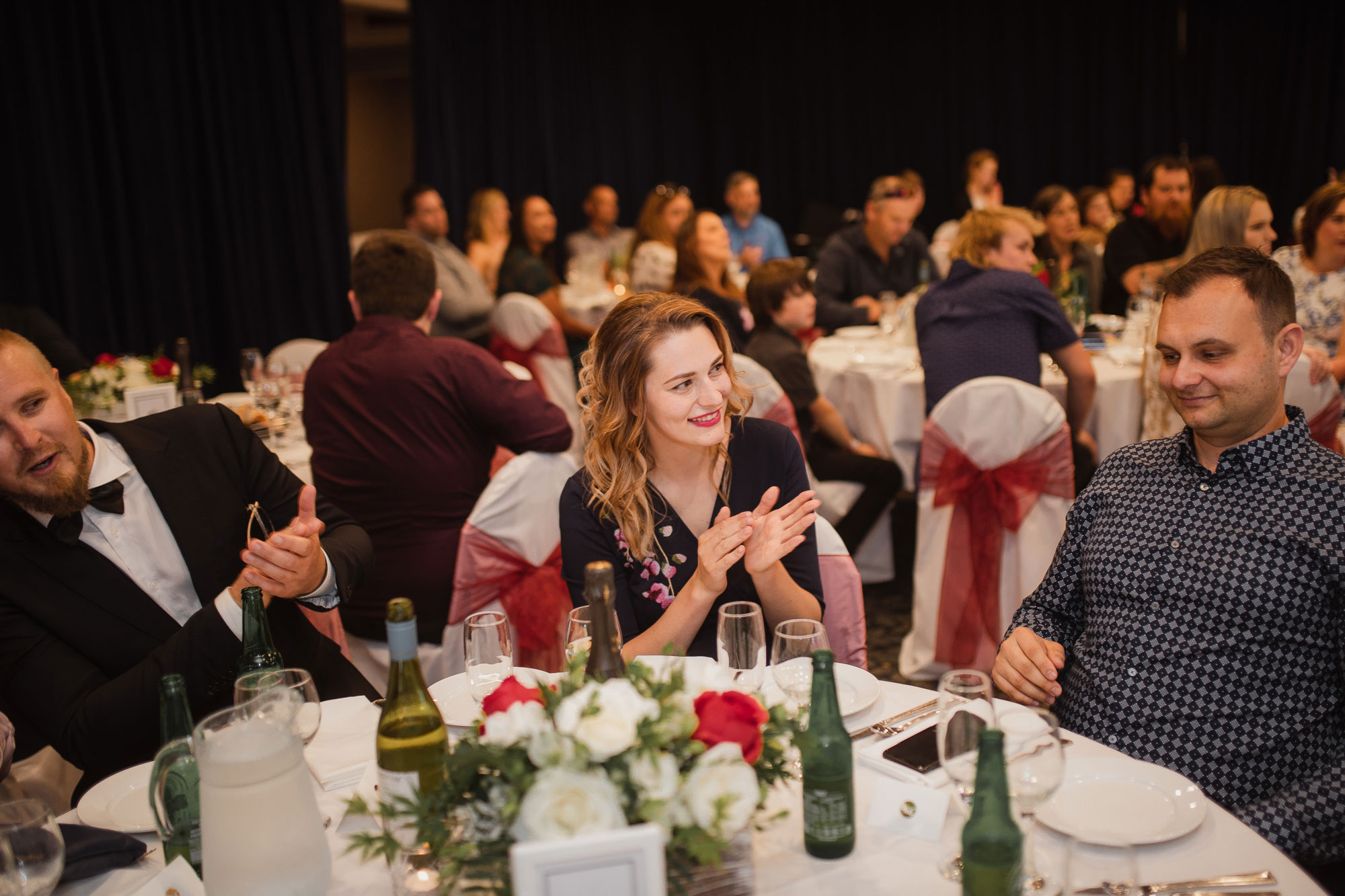 wedding guests clapping and cheering