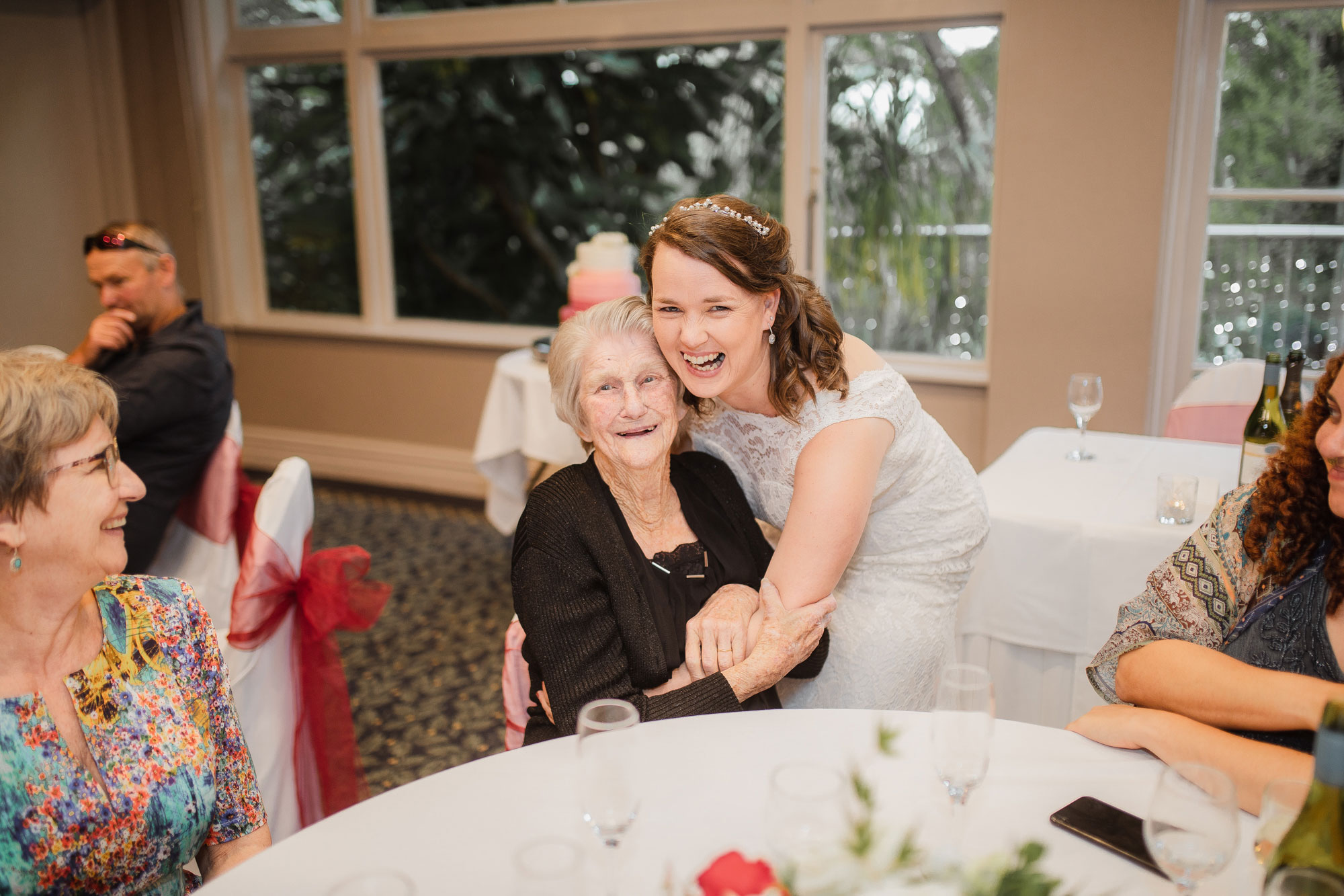 bride and guest smiling