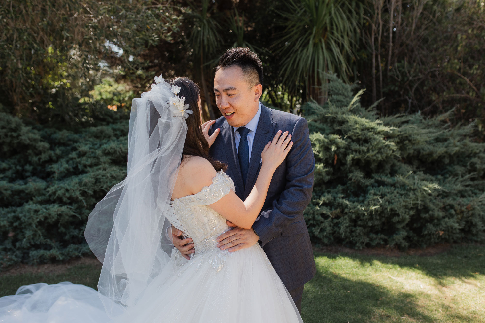 groom looking at bride