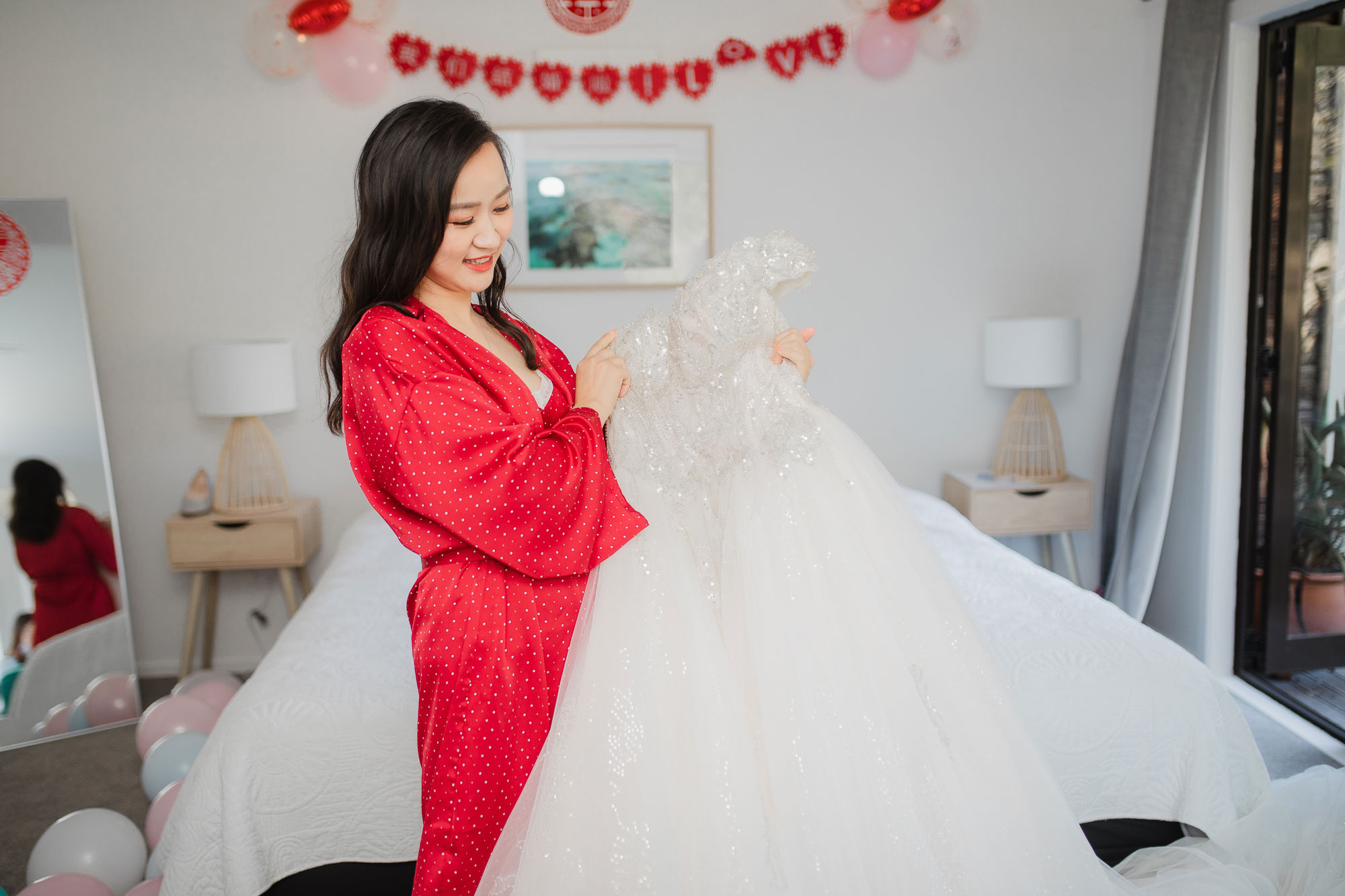 bride looking at her dress