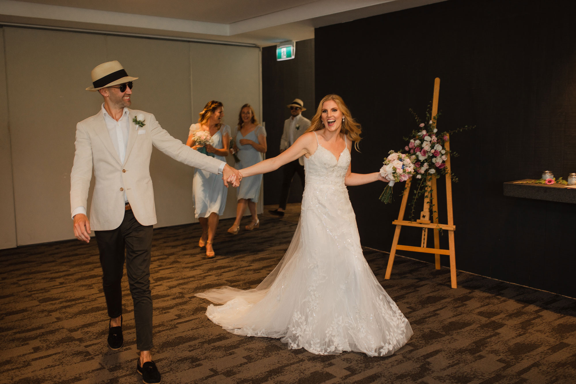 auckland bride and groom arrive at reception