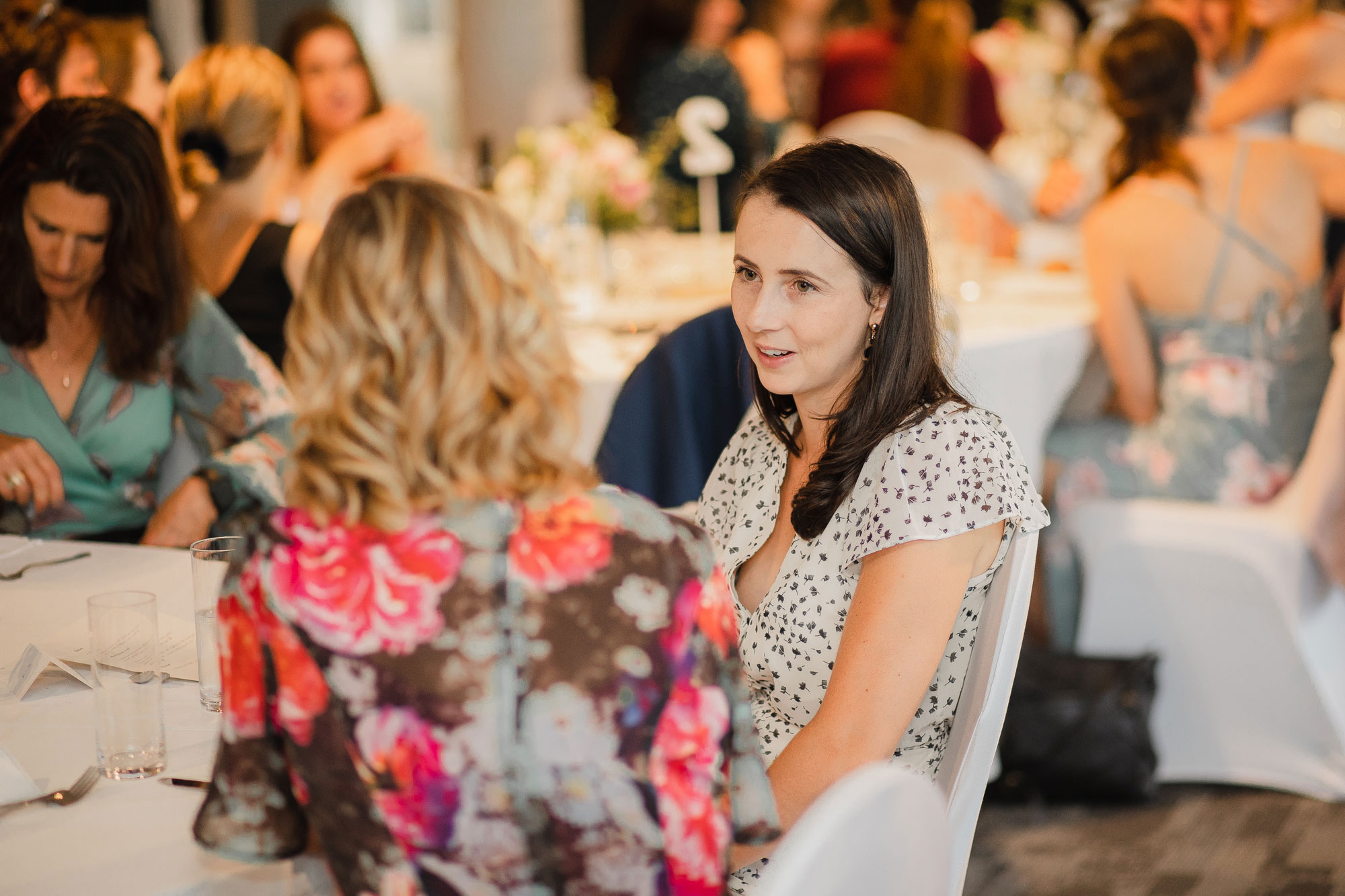 wedding guests chatting at reception