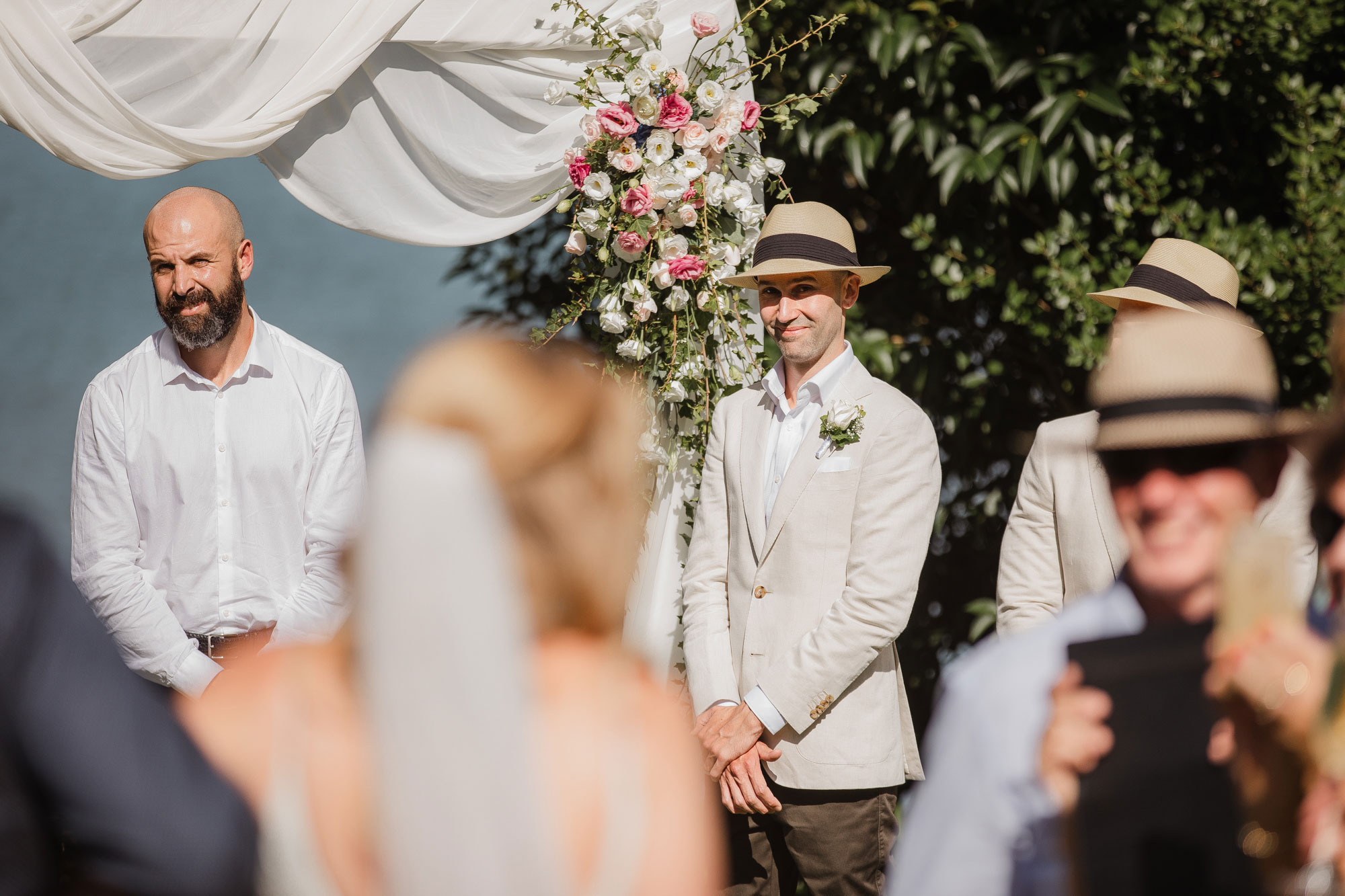 groom reacting to bride walking down the aisle