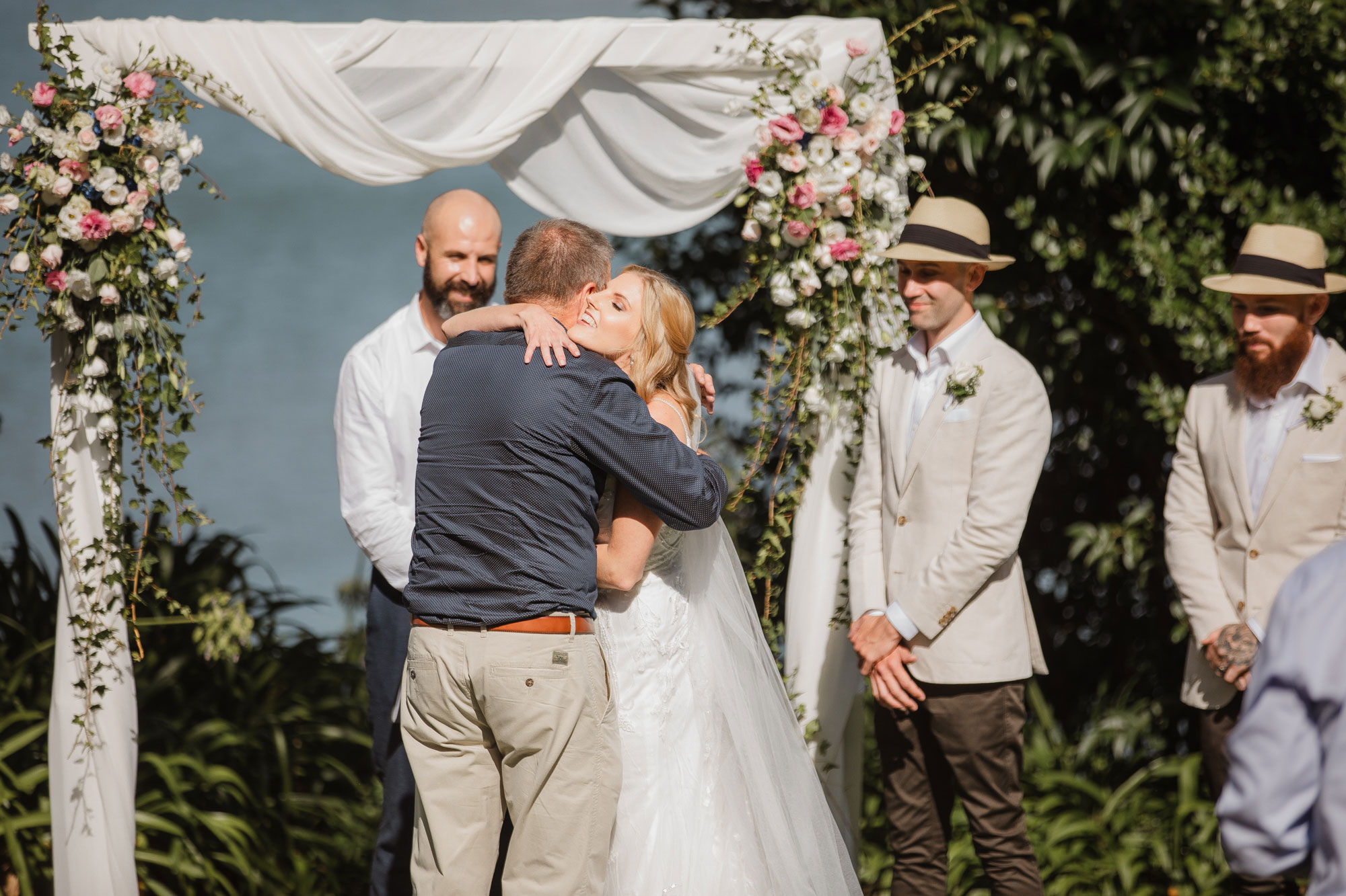 father giving bride away