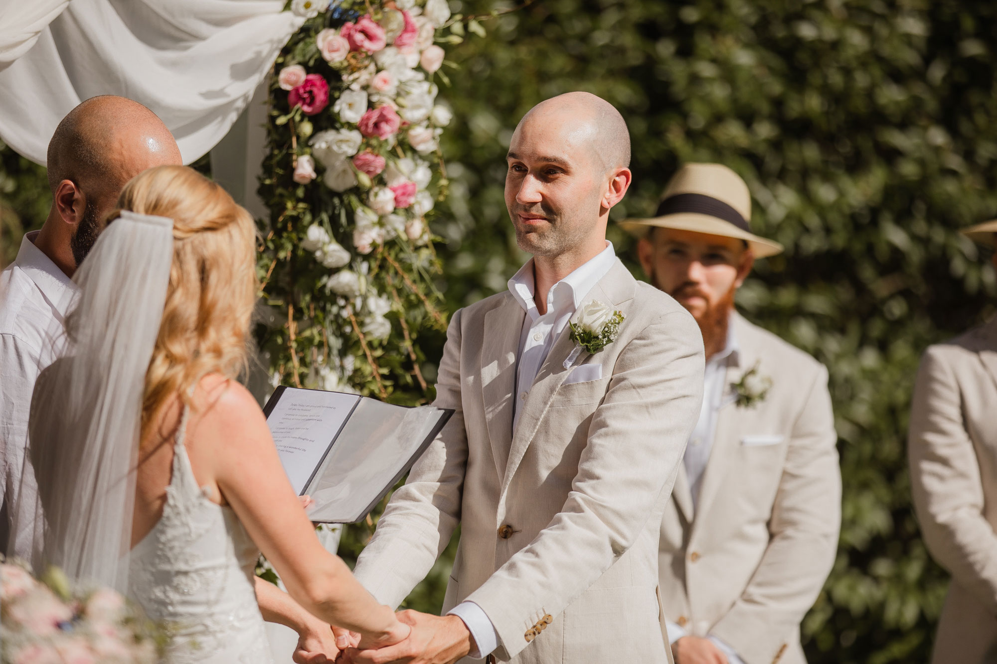 groom looking at the bride