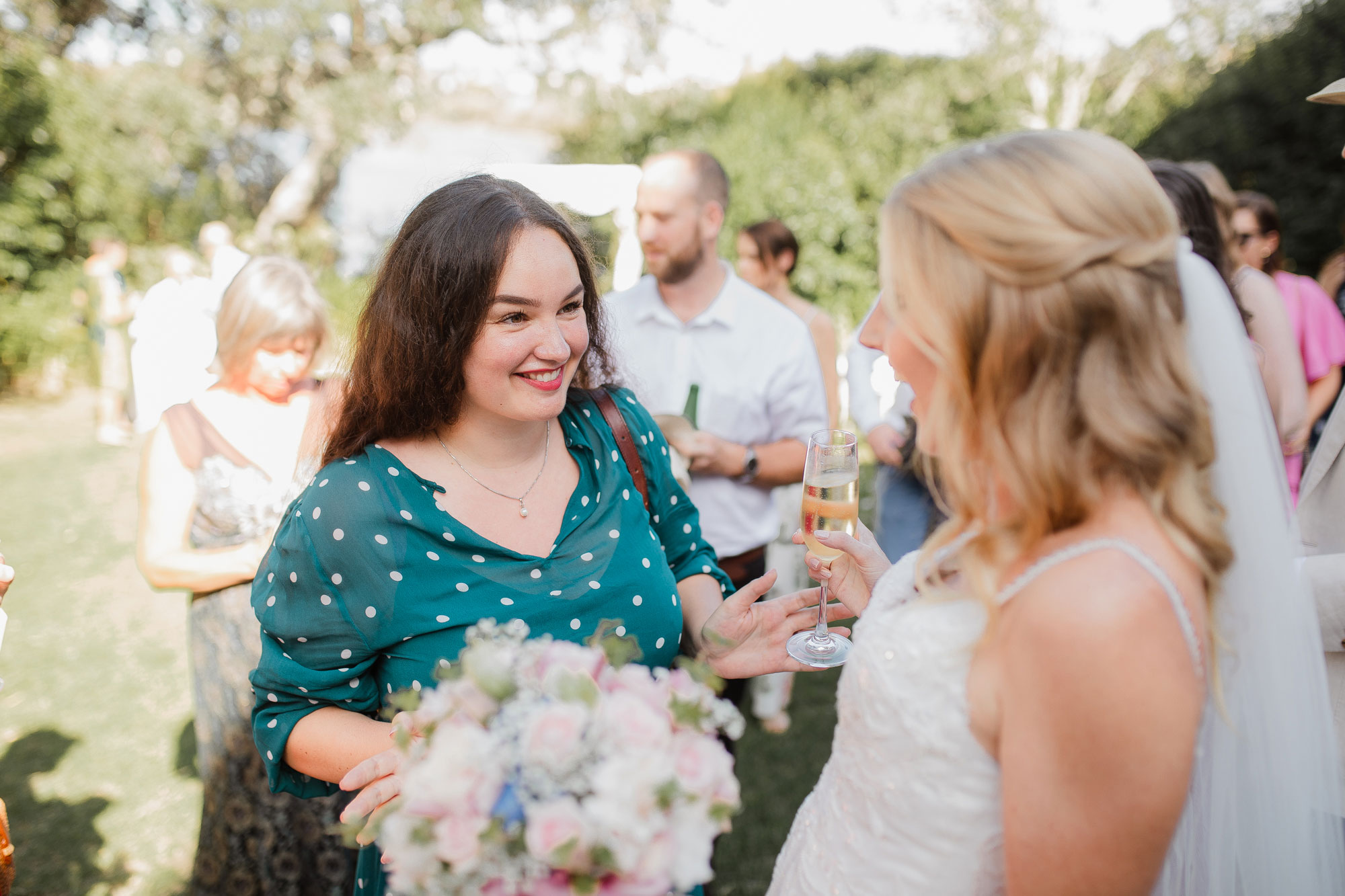 guest talking to the bride