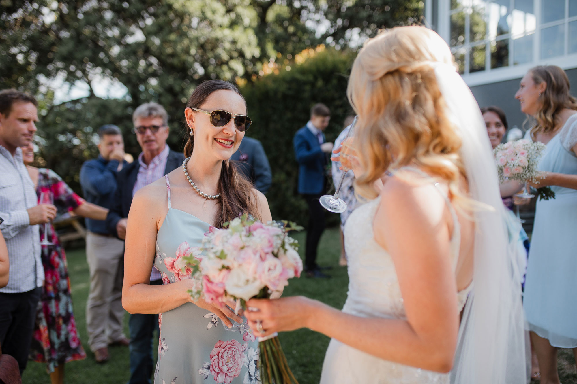 guests chatting with the bride