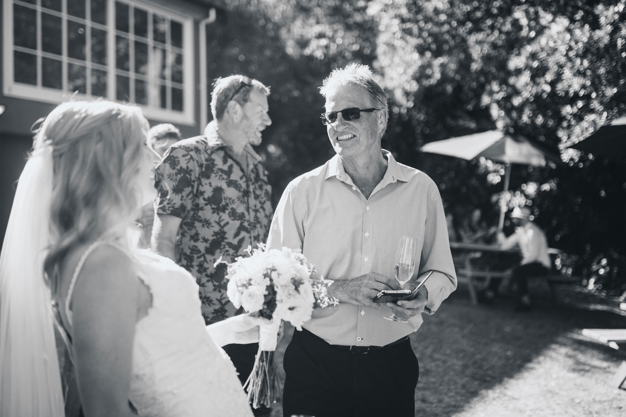 family chatting with the bride