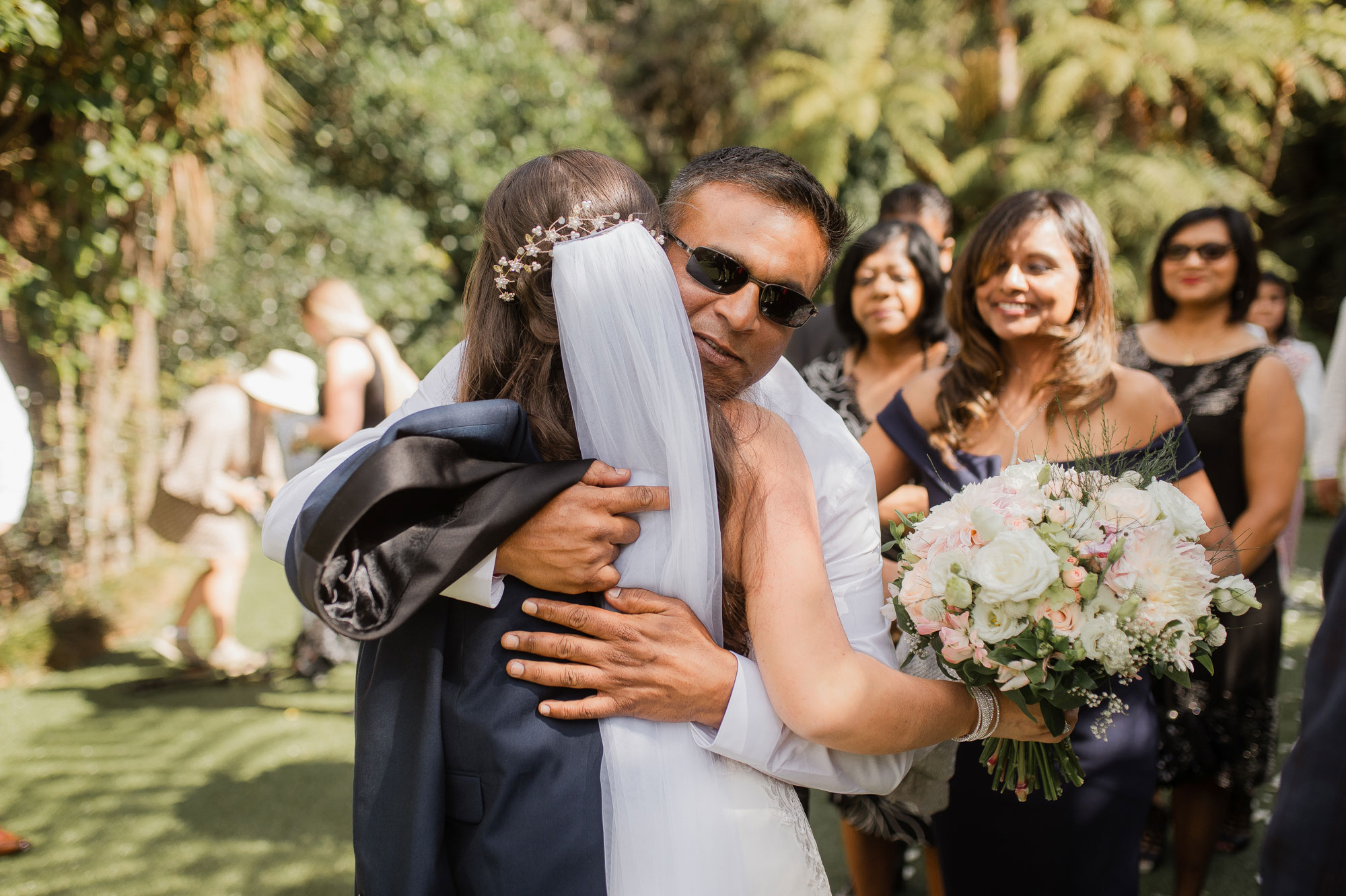 wedding guest hugging the bride