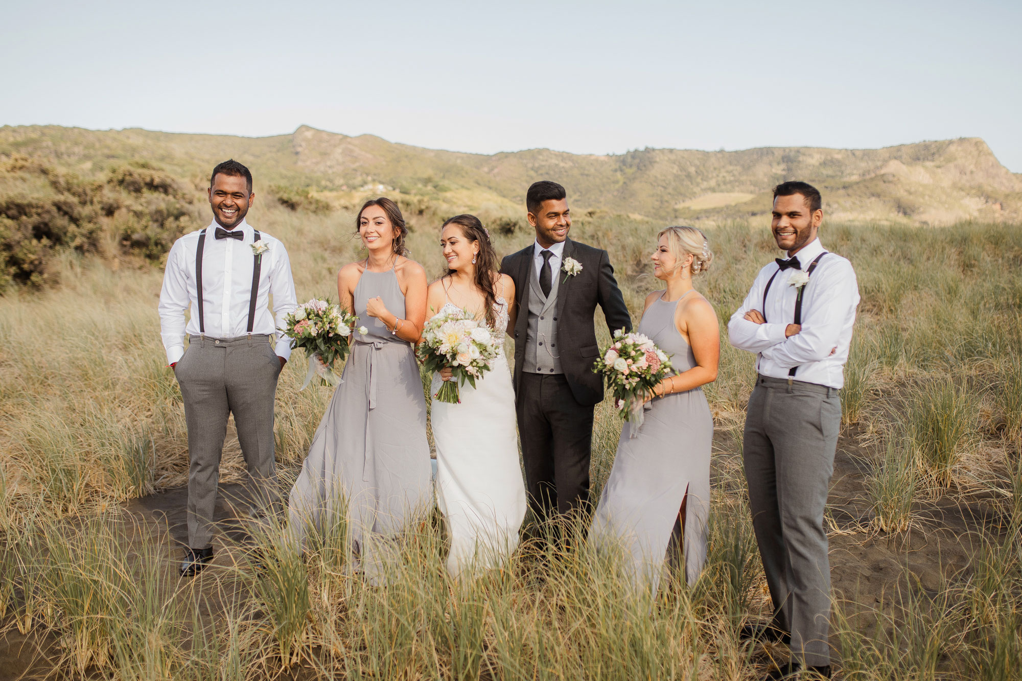 bridal party photo at bethells beach