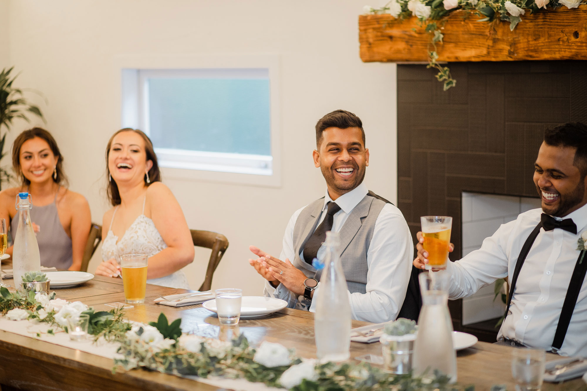 groom laughing at reception