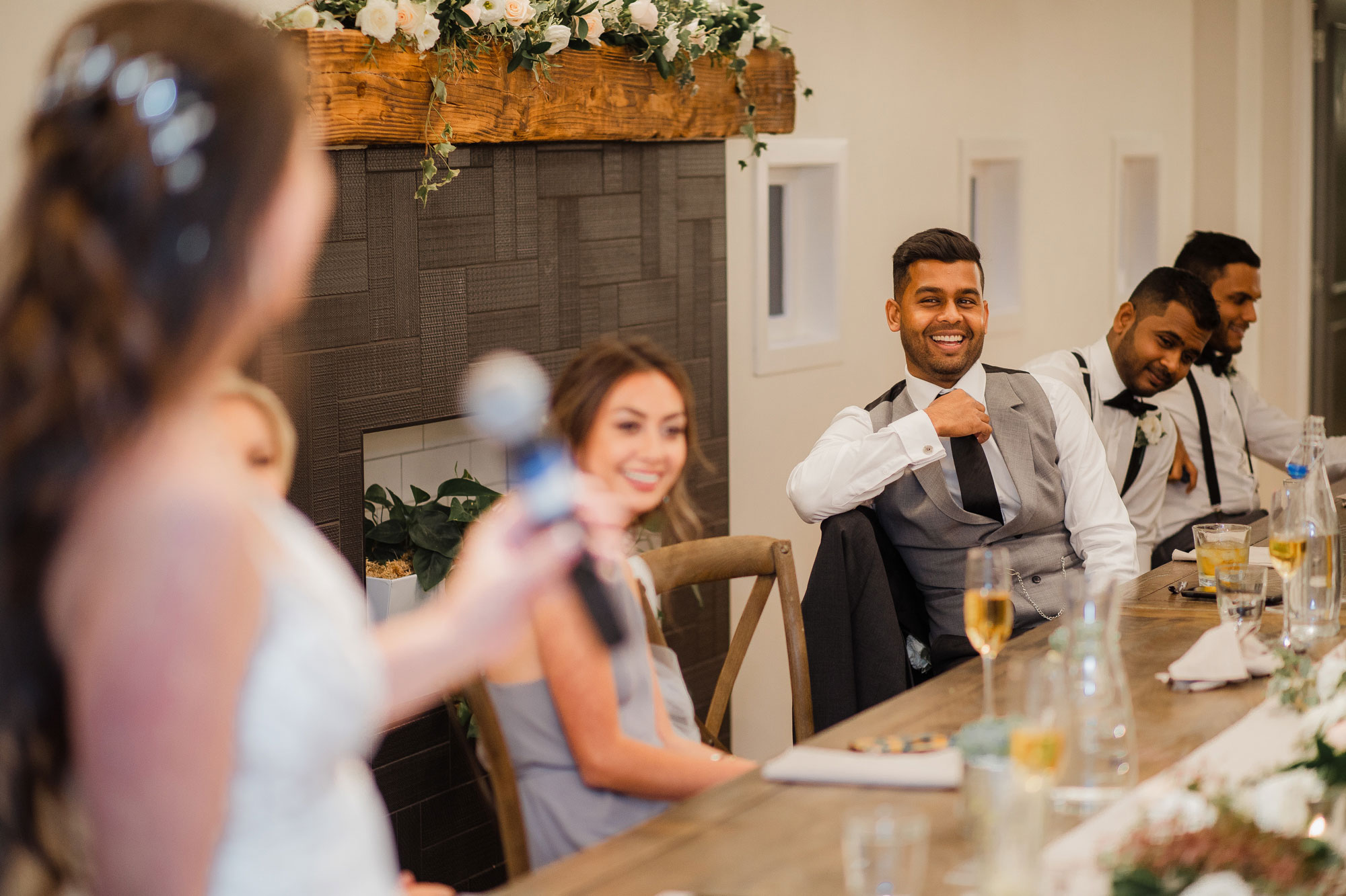 groom listening to bride's speech