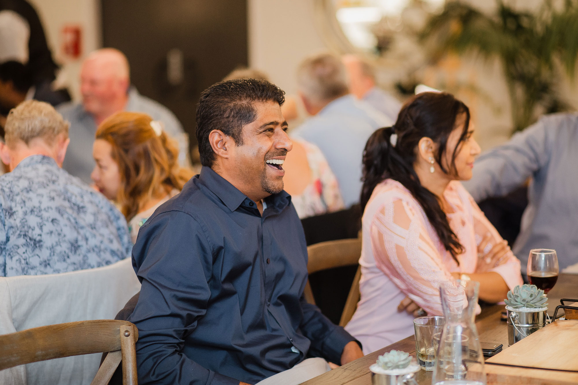 wedding guests laughing