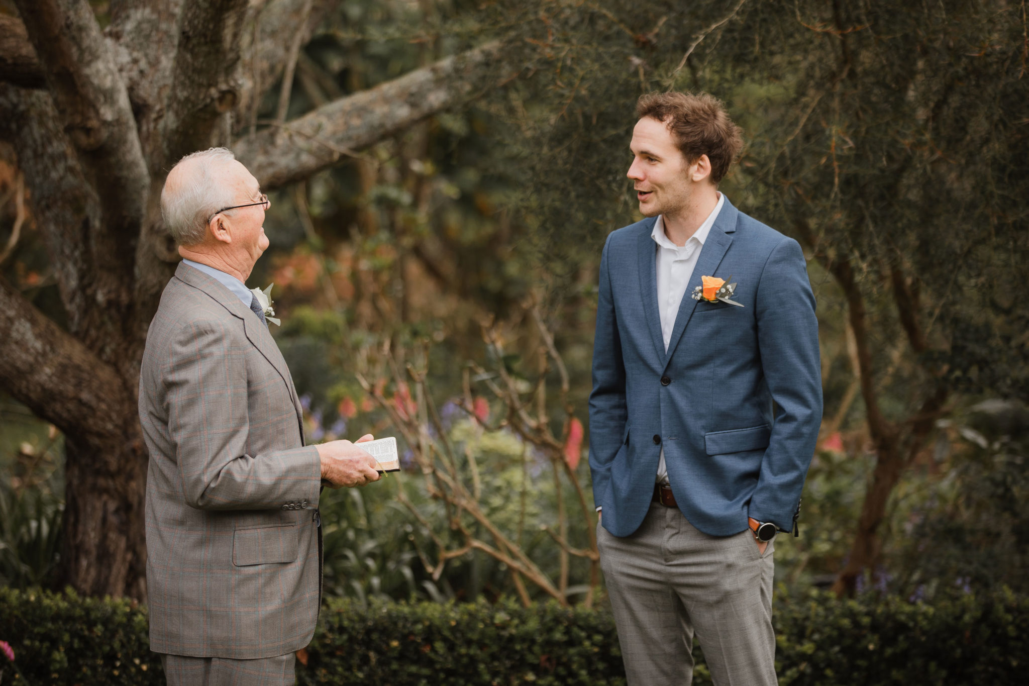 groomsman talking to father of groom