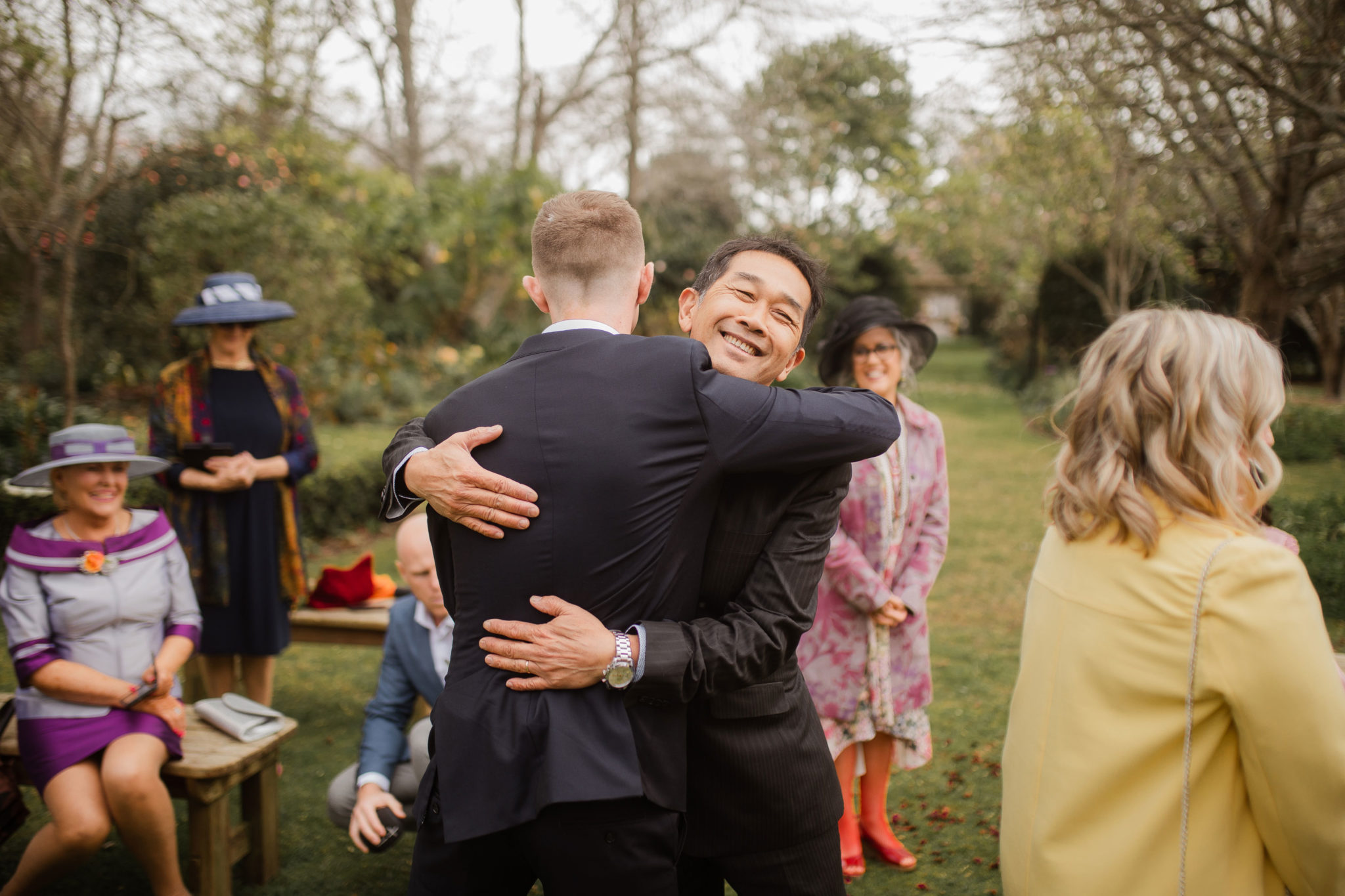 groom hugging father in law